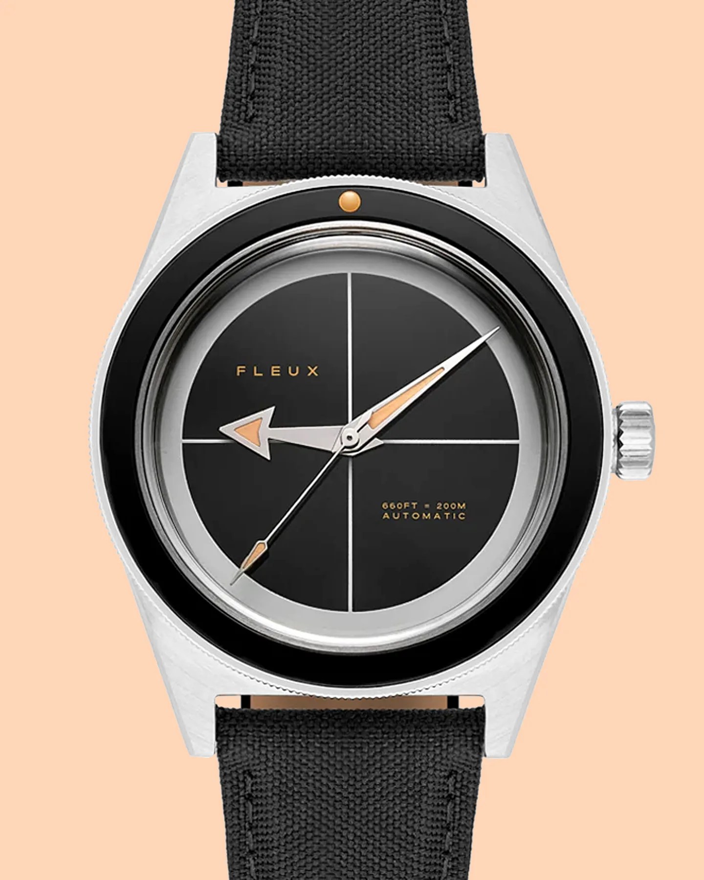 a black dial dive watch with pointed hands