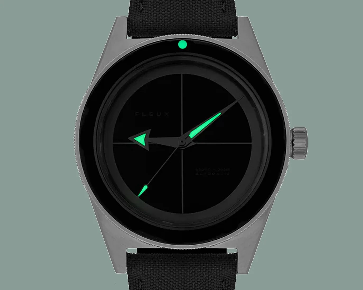 a black dial dive watch with lume glowing