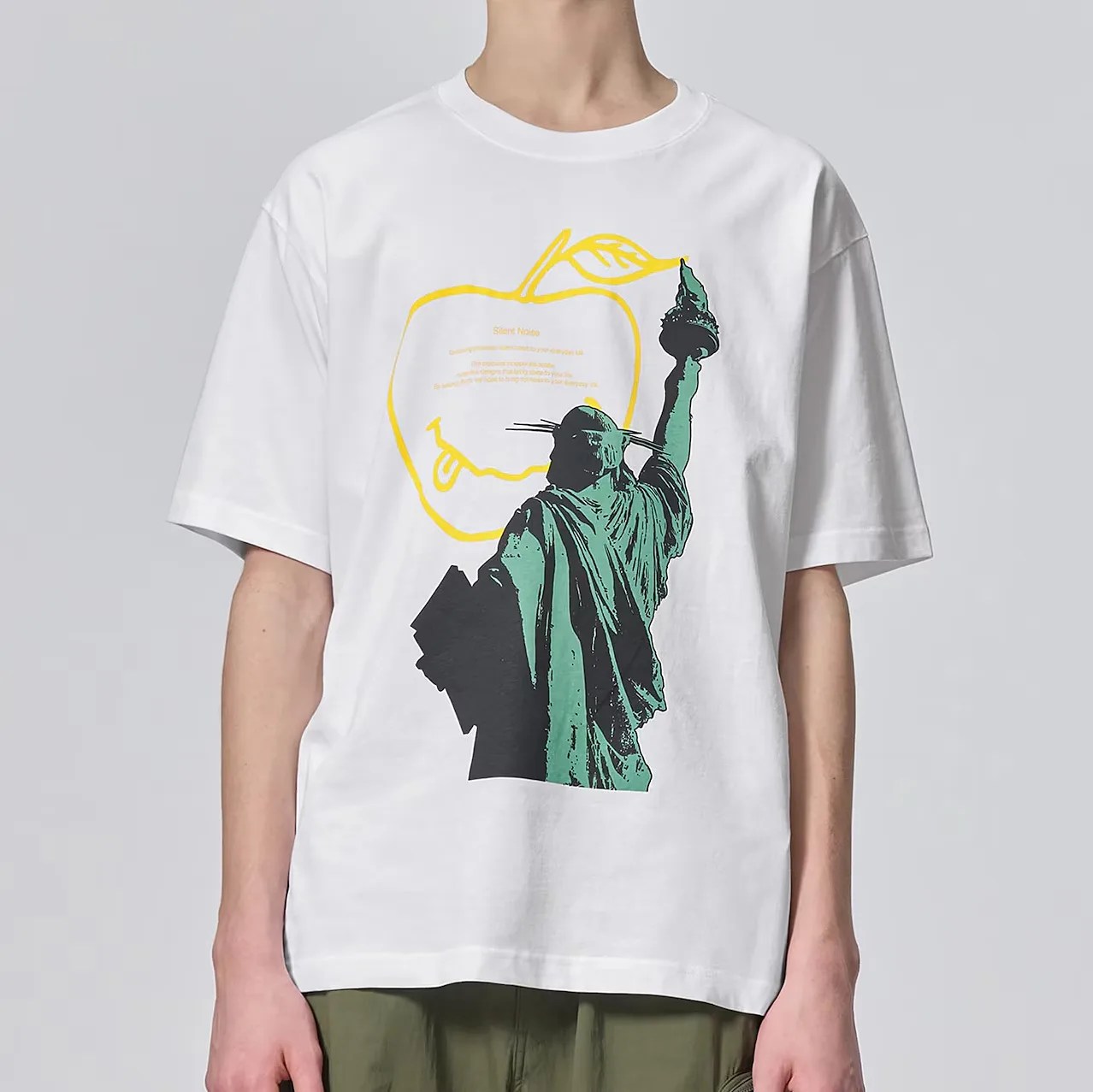 a man in a white t-shirt with the statue of liberty on it