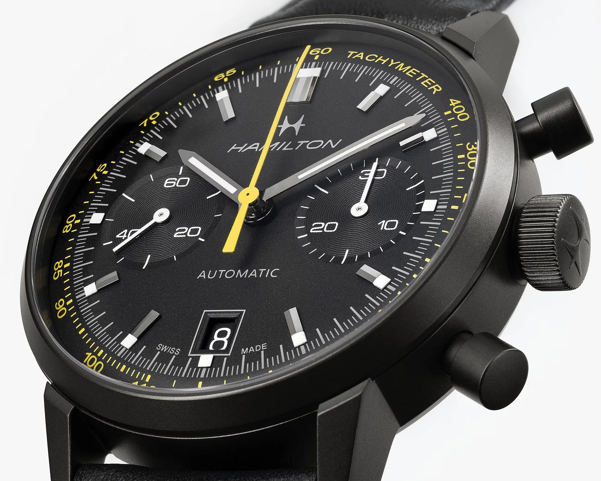 a black chronograph dial with yellow details
