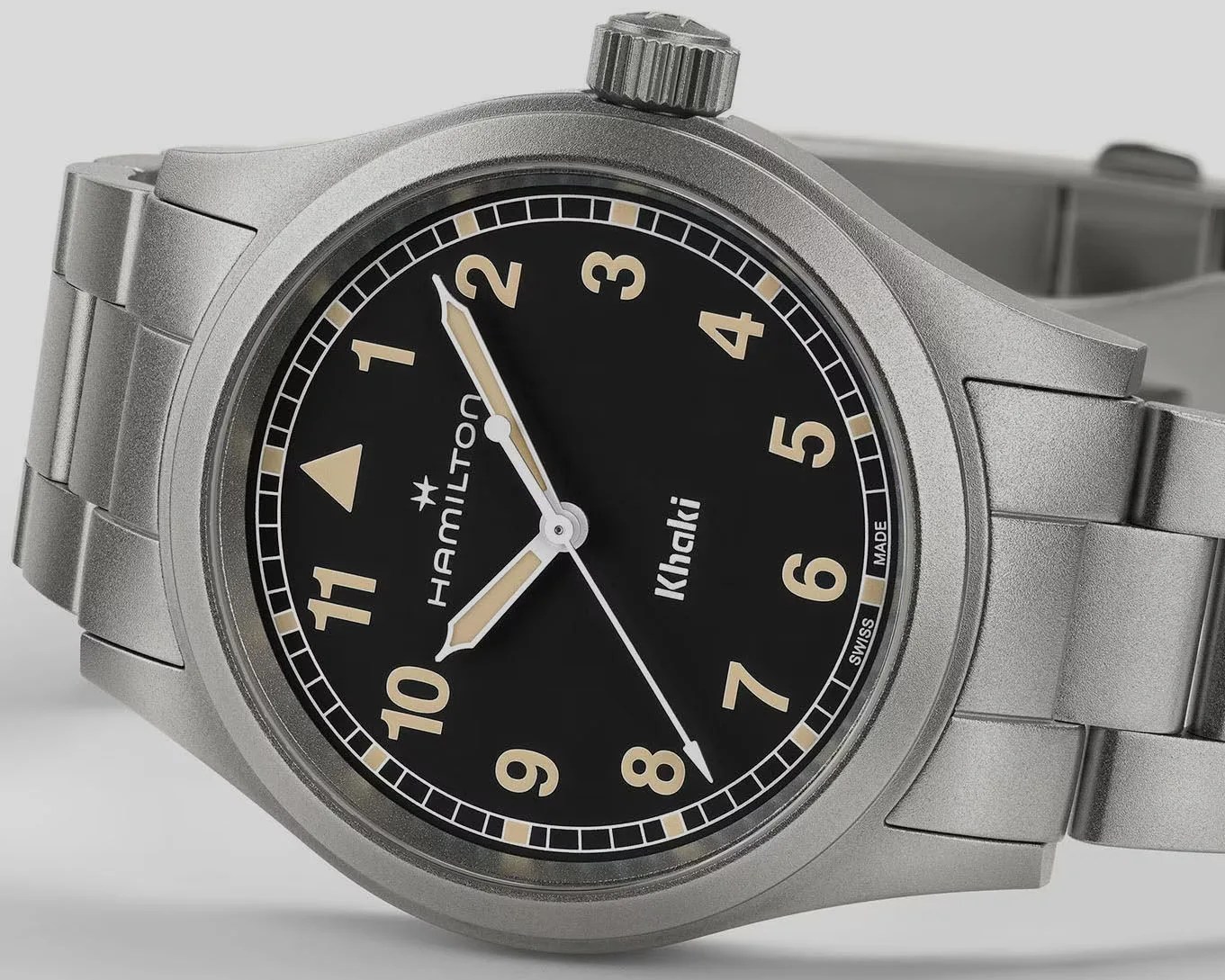 a black hamilton field watch with steel bracelet