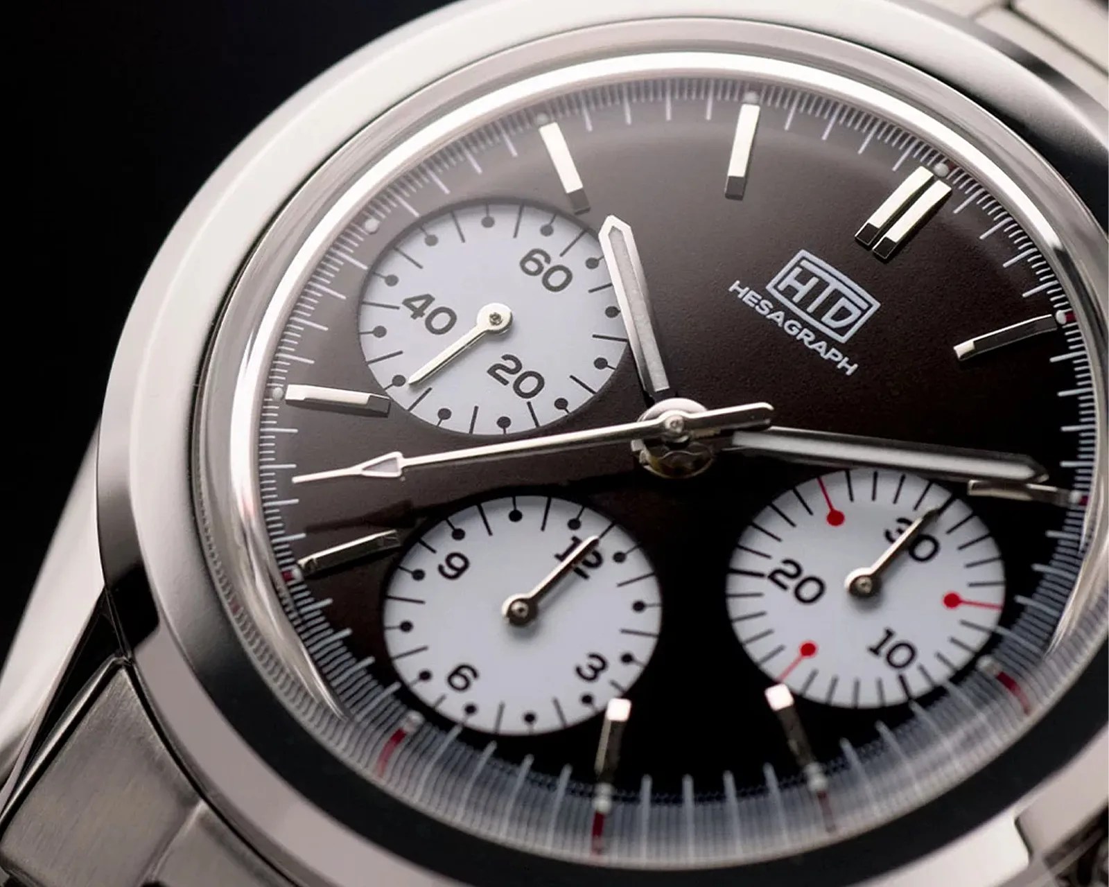 close up of the dial on a steel chronograph watch