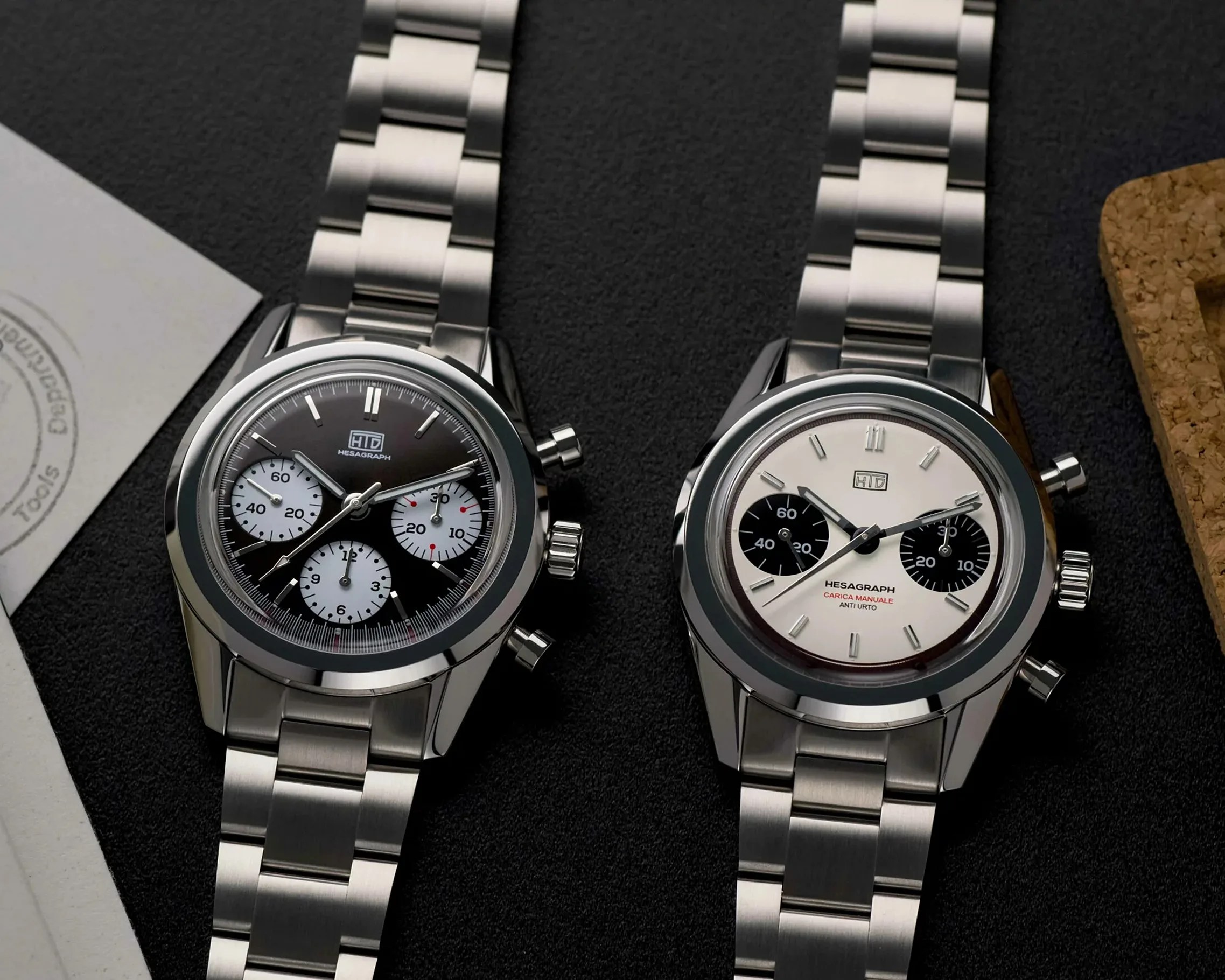two steel chronographs laying next to each other