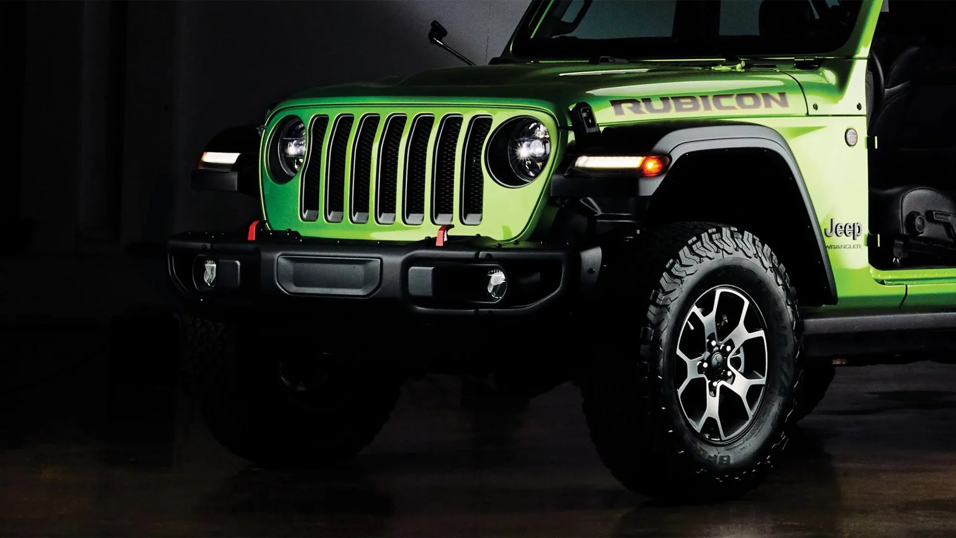 front grill of a green jeep wrangler
