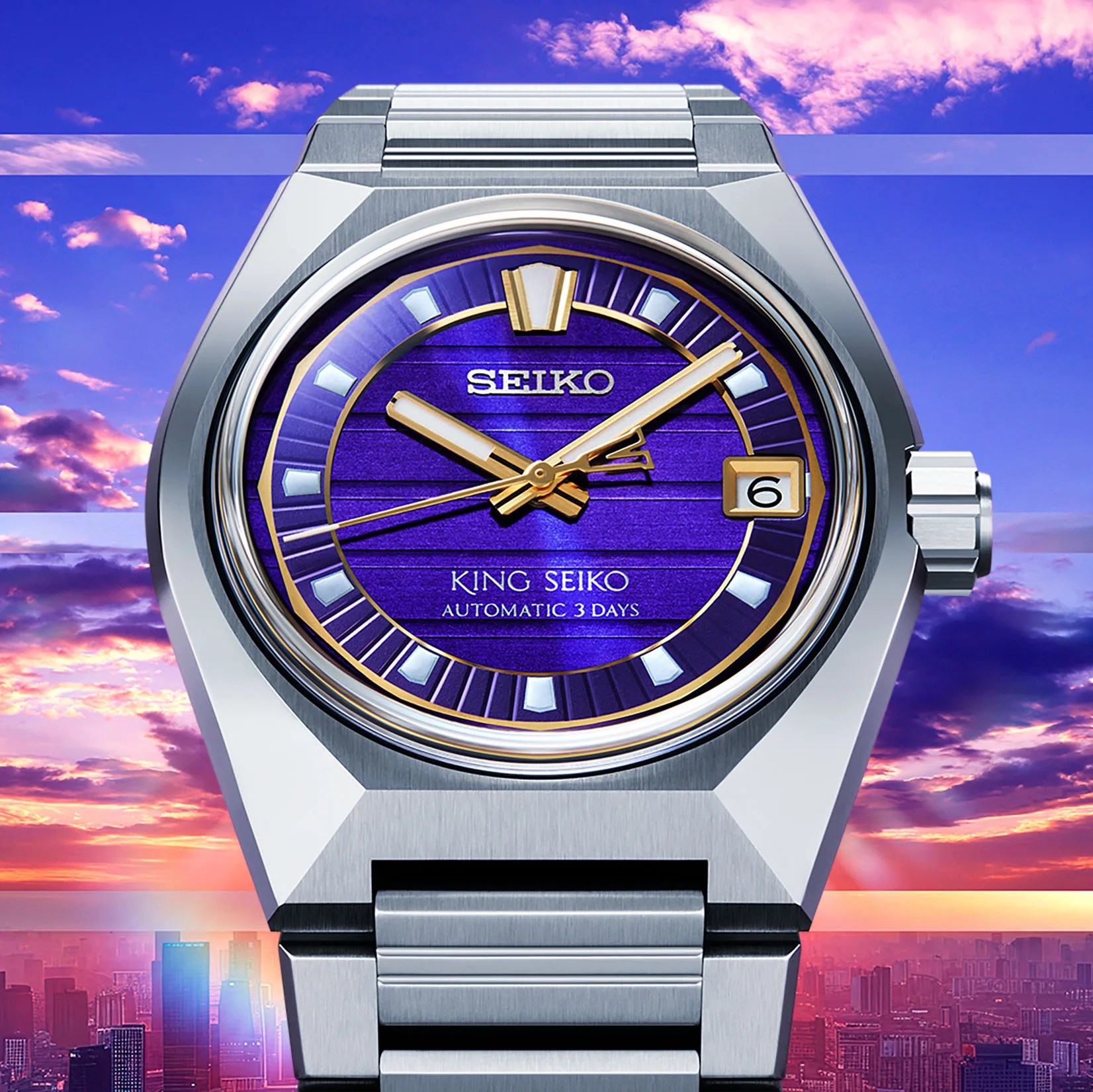 a steel King Seiko watch with a purple and gold dial against a city background