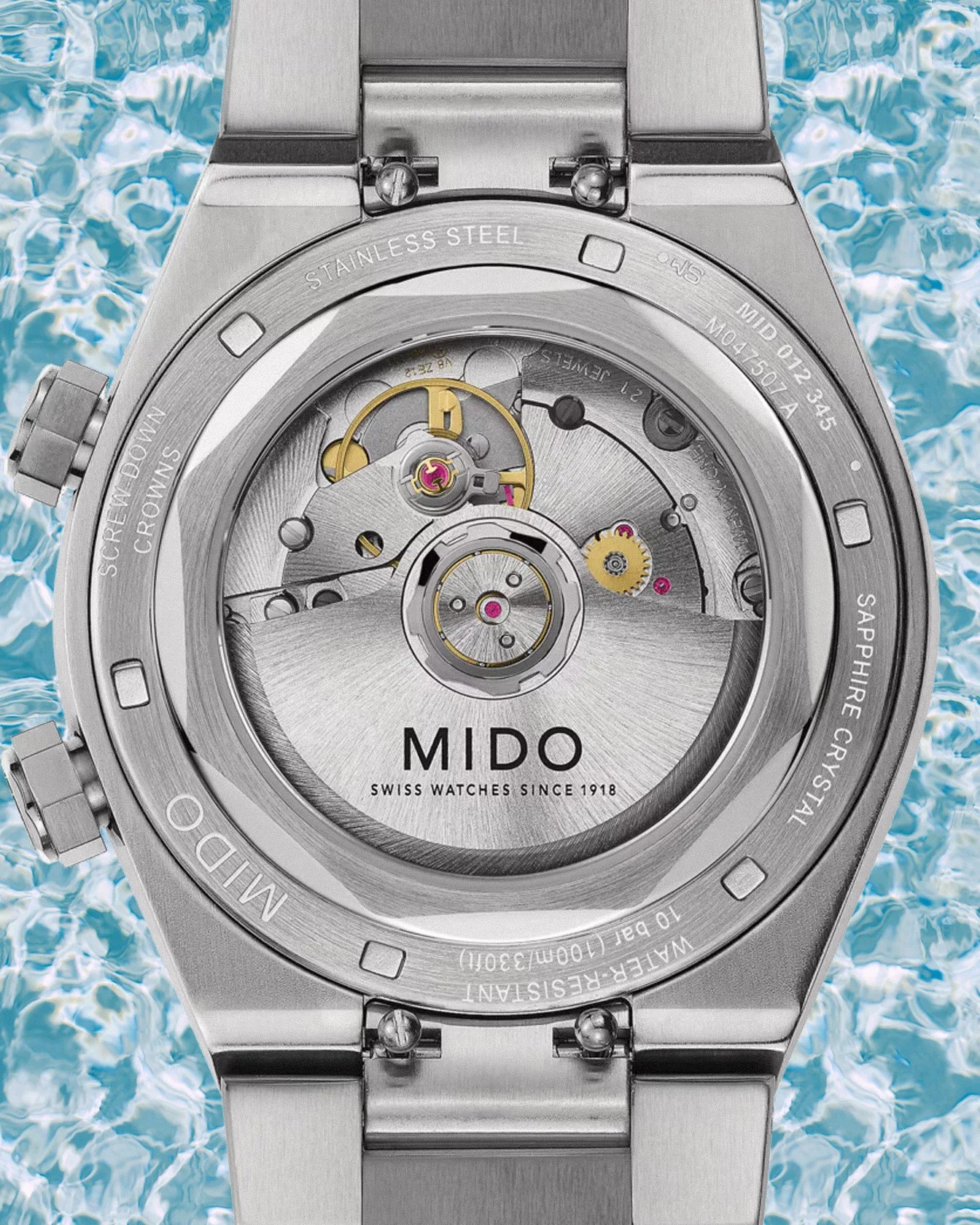 the exhibition case back of a Mido steel dress watch