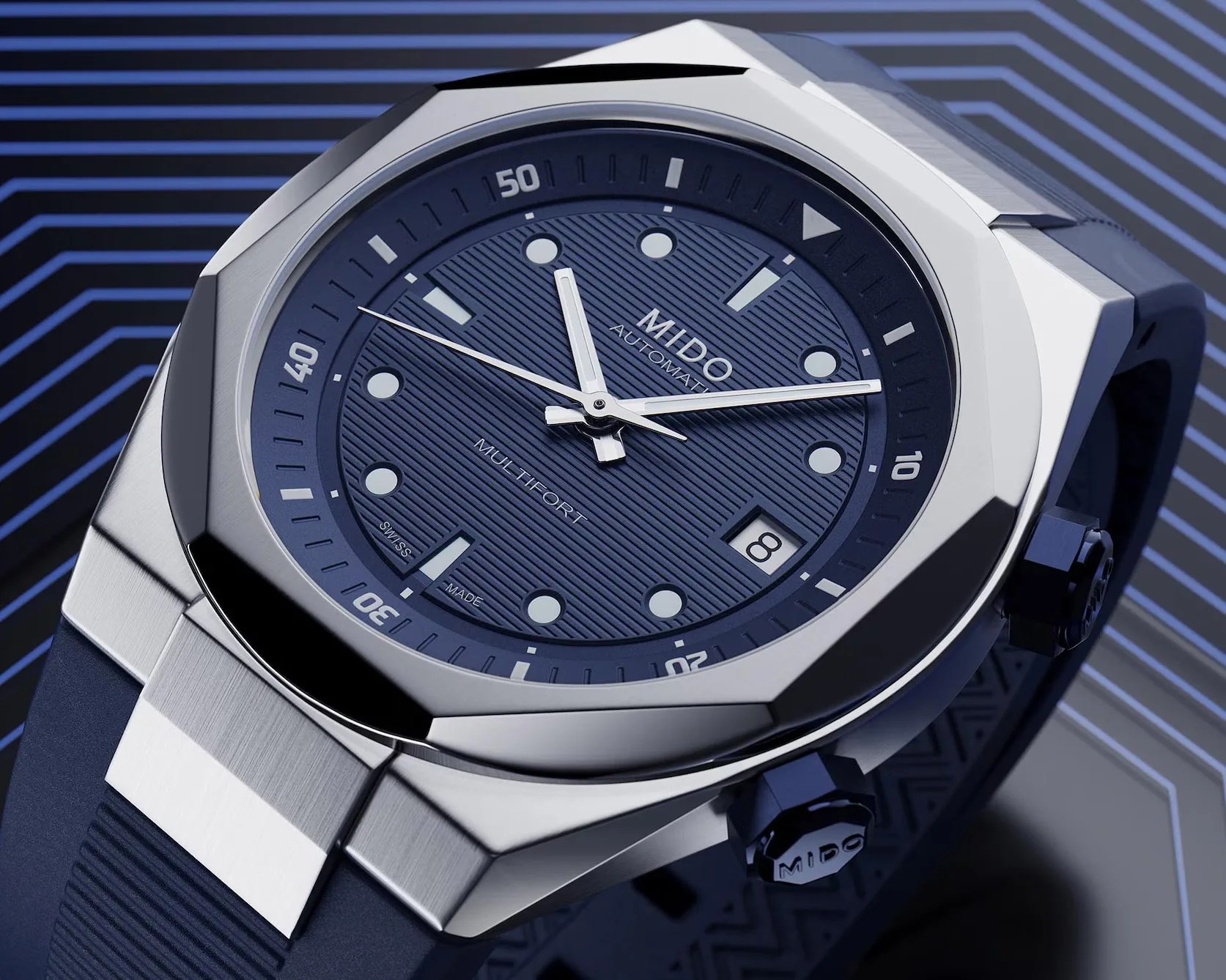 a steel dive watch with a blue dial and strap