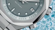 the dial, crowns and bezel of a steel watch