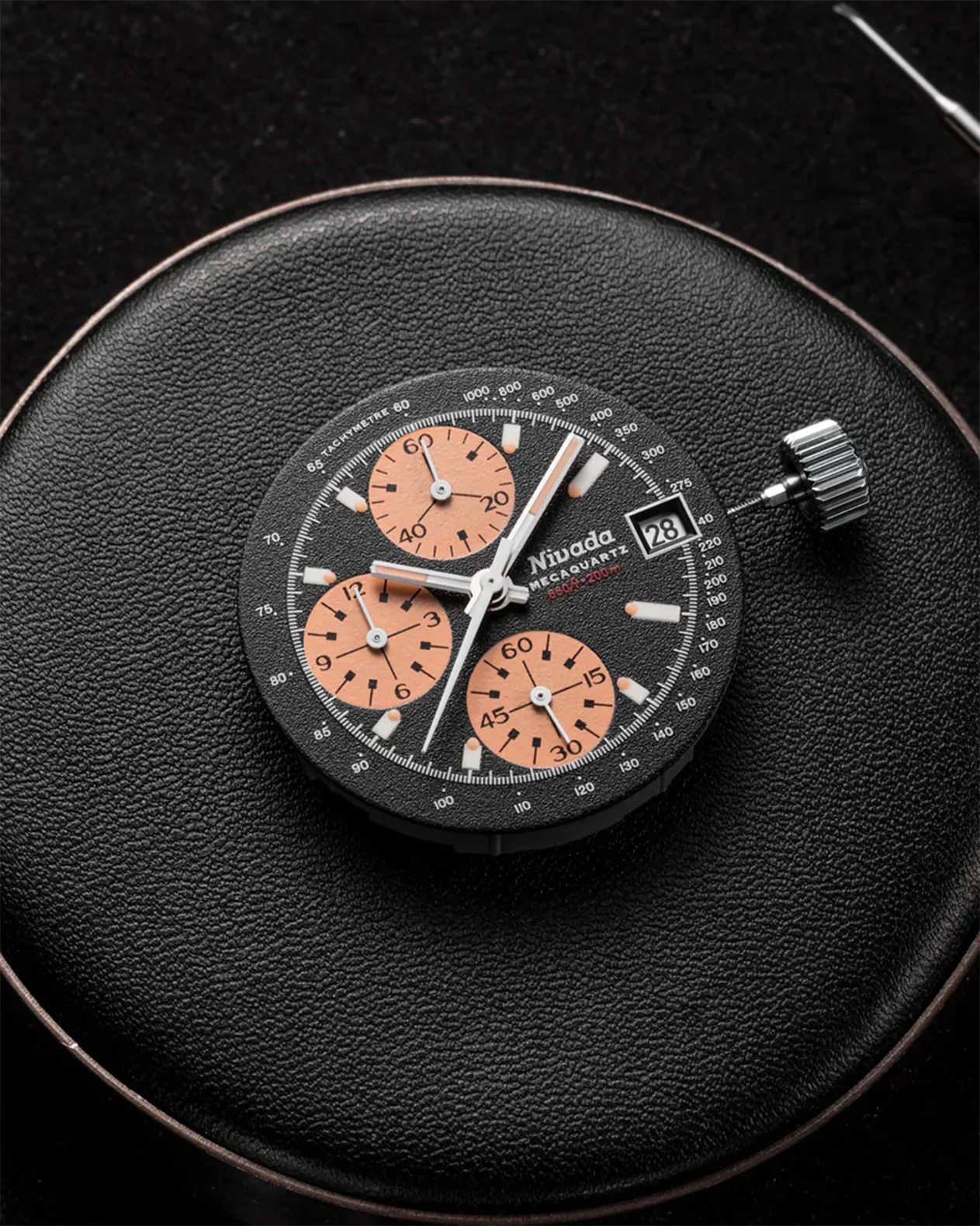a chronograph watch dial removed from the watch case