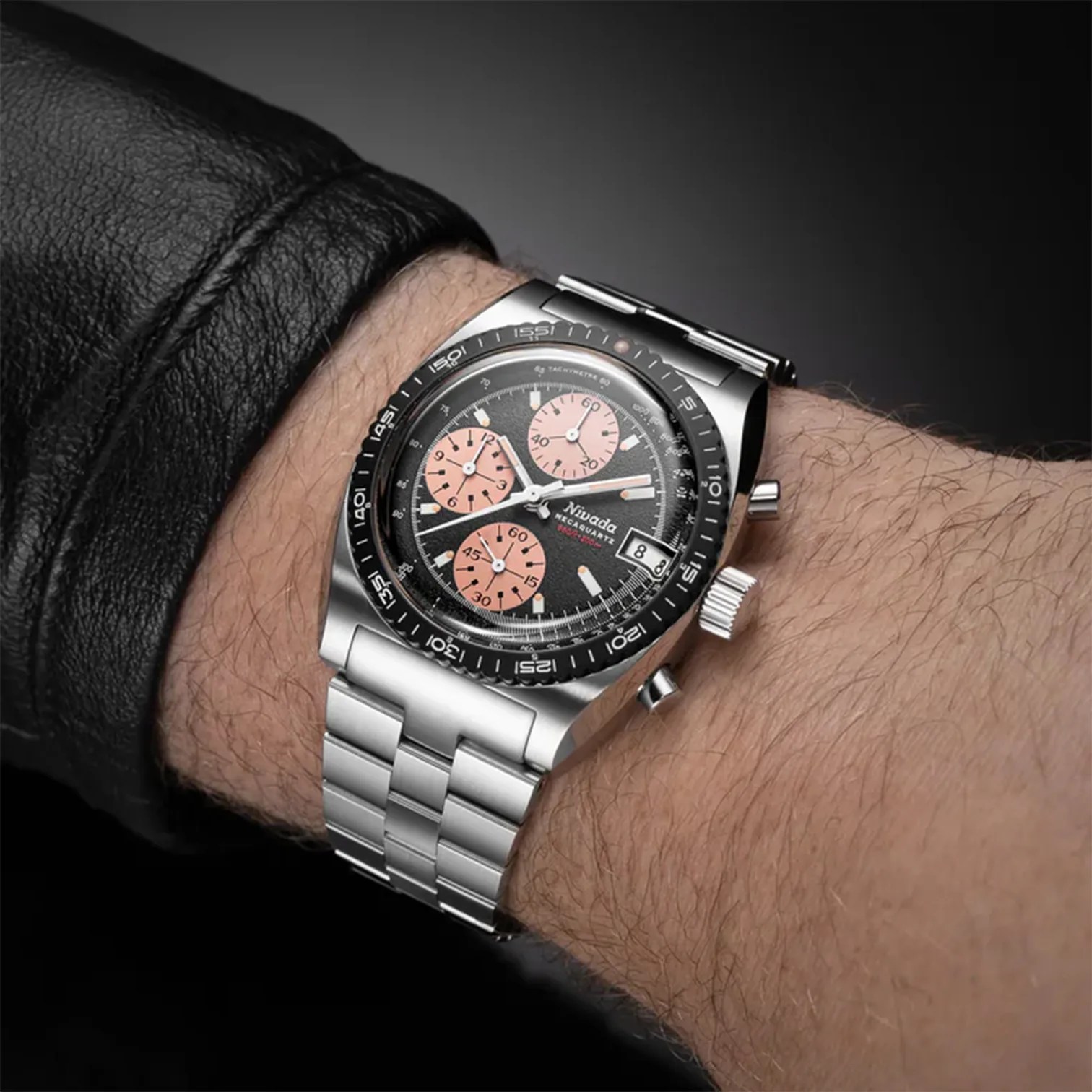 a Nivada Grenchen chronograph watch on a man's wrist