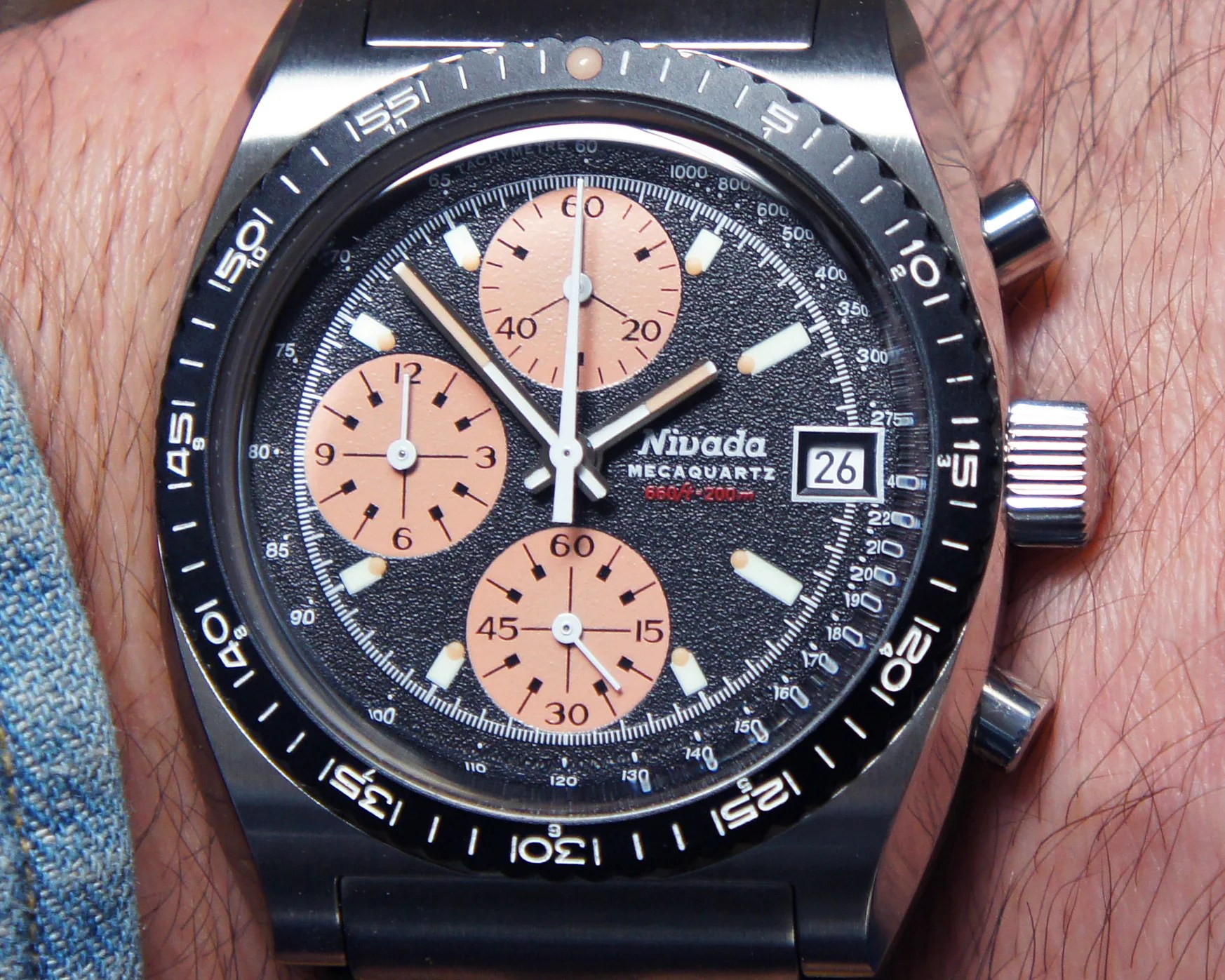 the dial of a Nivada Grenchen chronograph watch