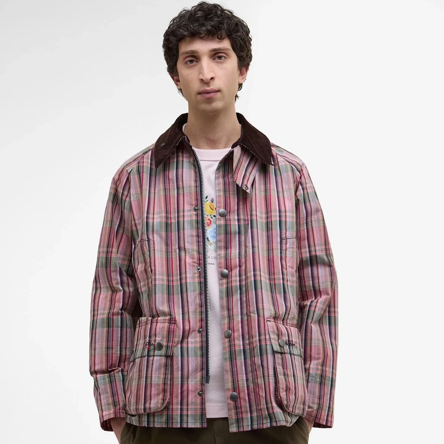 A man in a pink plaid jacket