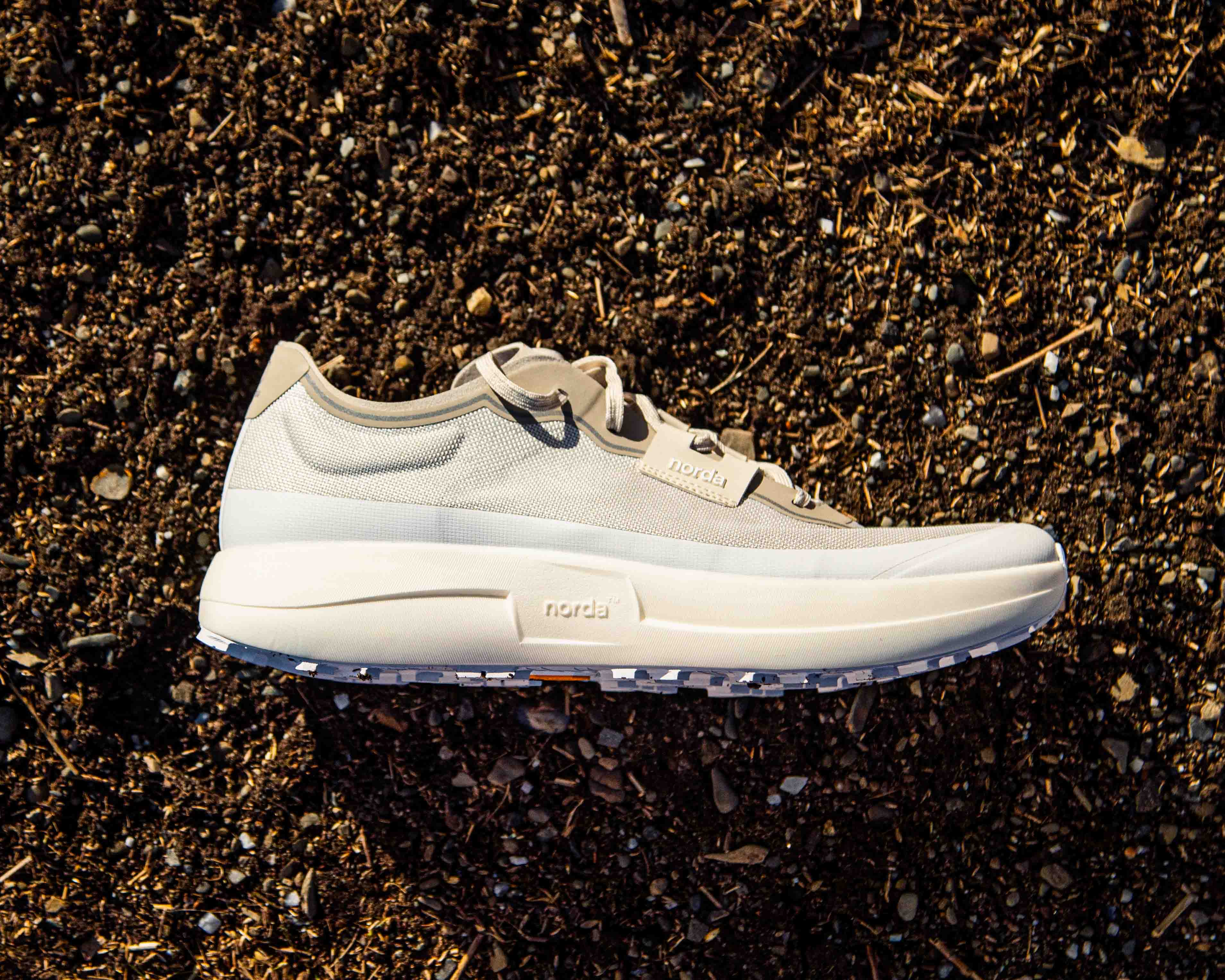 norda 005 shoe laying flat on a dirt surface