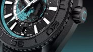 the dial, crown and bezel of an Omega Planet Ocean dive watch