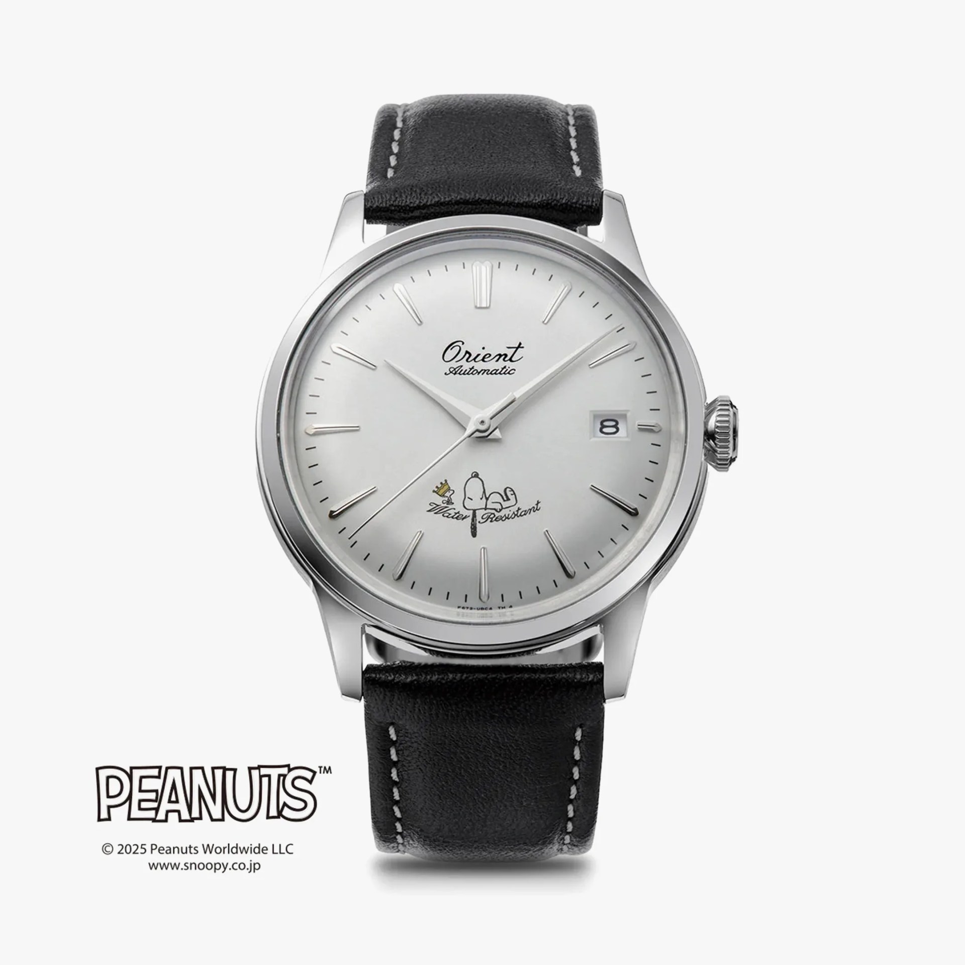 a white dial Orient dress watch with snoopy and woodstock on it