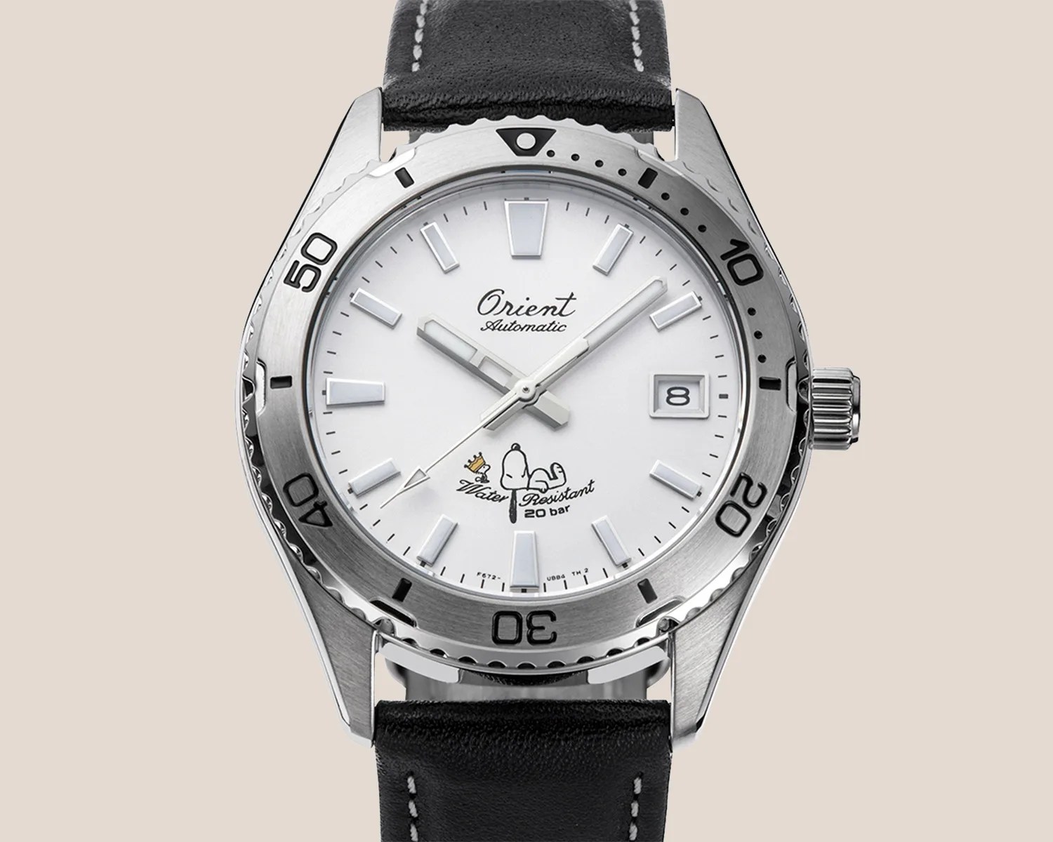 a steel watch with a white dial, with a picture of Snoopy and Woodstock on it