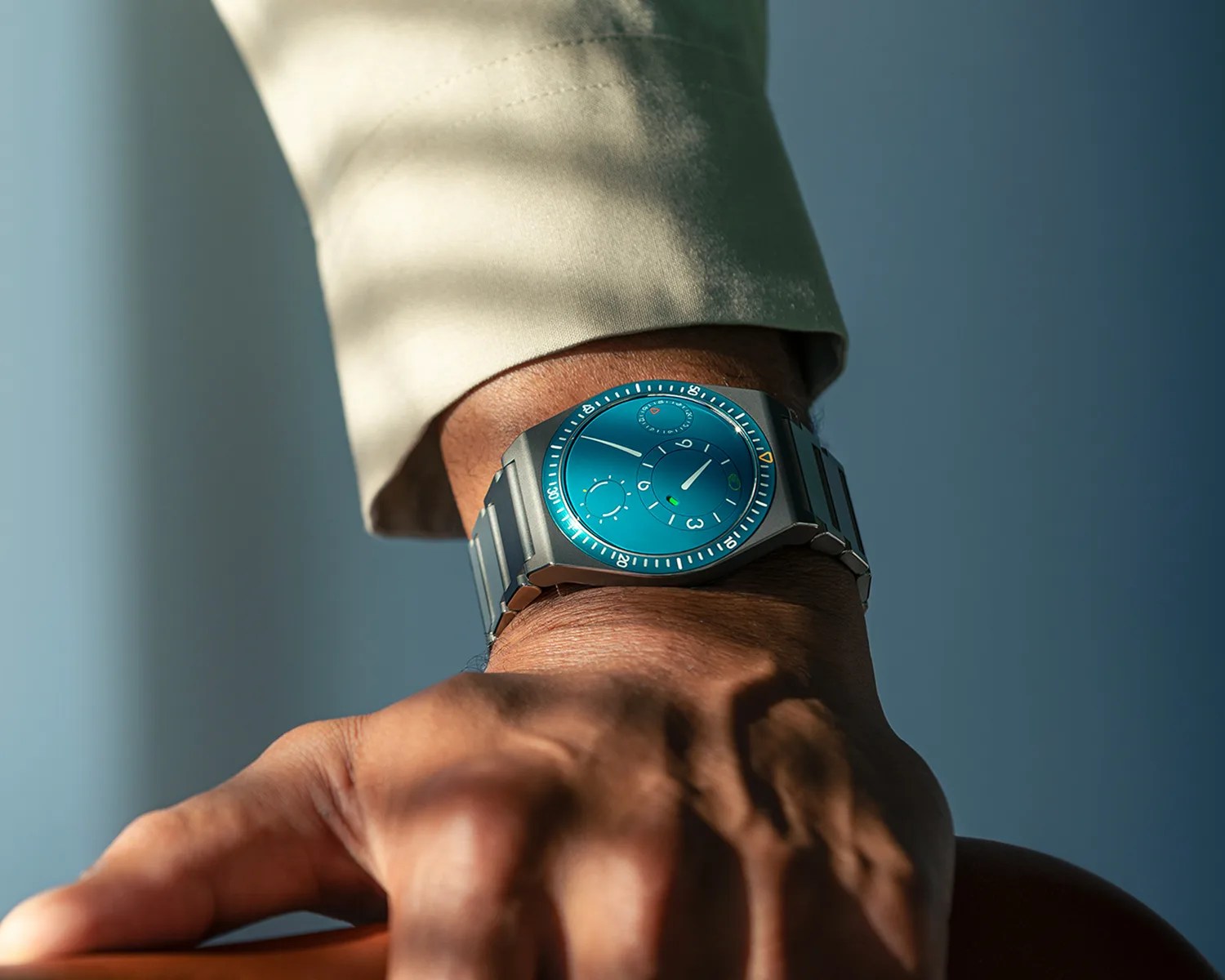 a closeup of a ressence tool watch on a mans wrist