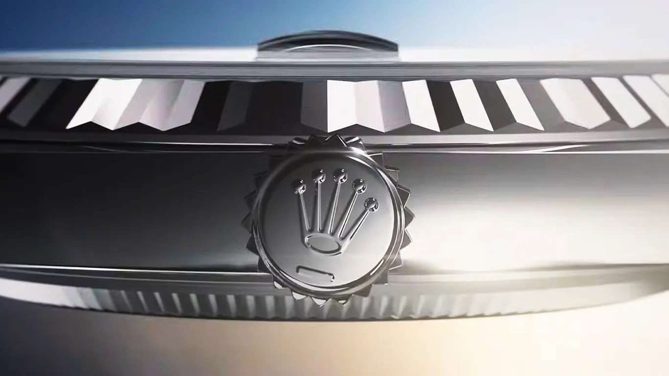 a closeup of a rolex watch crown