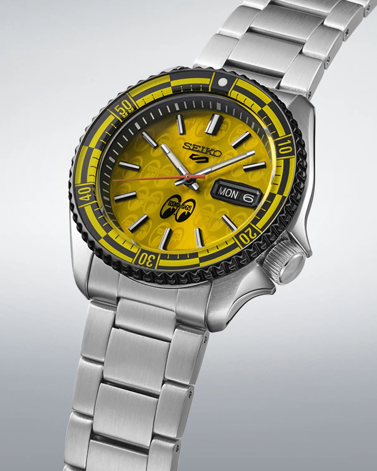 a yellow dial watch with a black and yellow bezel