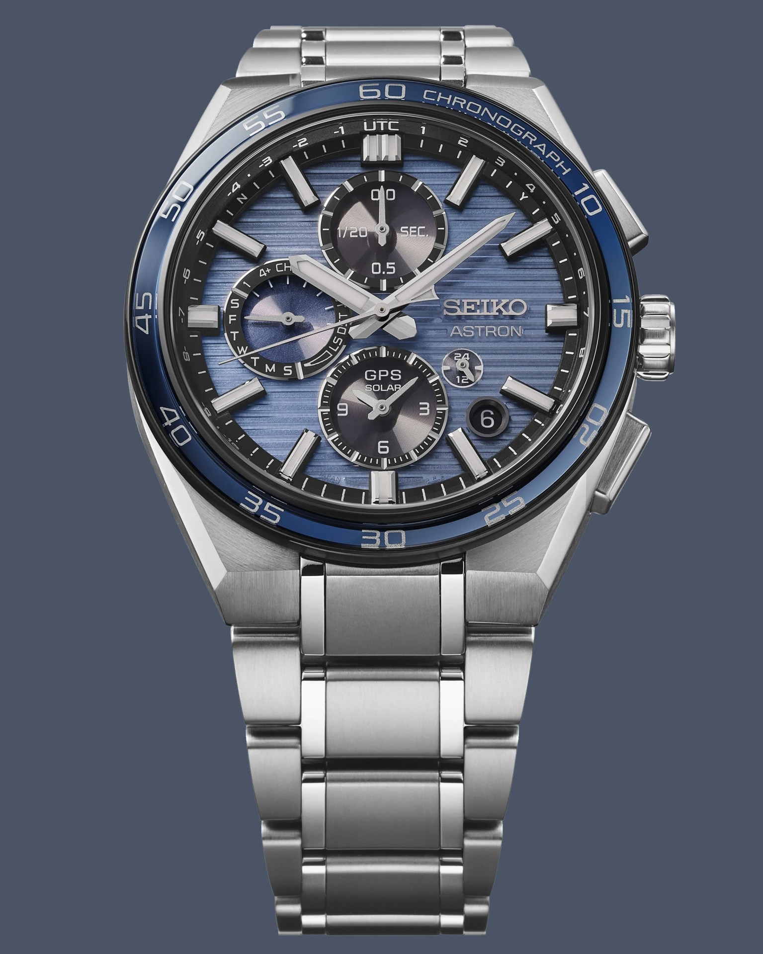 a steel Seiko chronograph with a blue dial and bezel