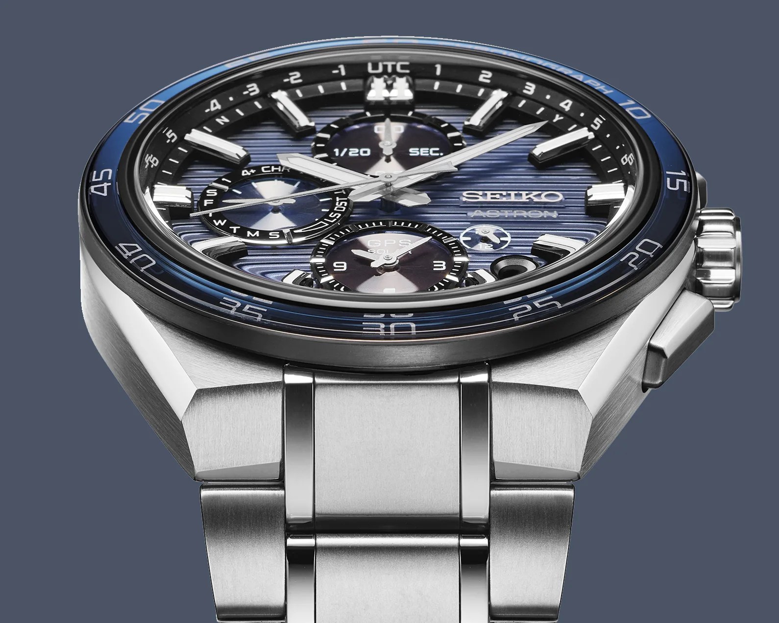 the lugs and integrated bracelet of a Seiko chronograph with a blue dial