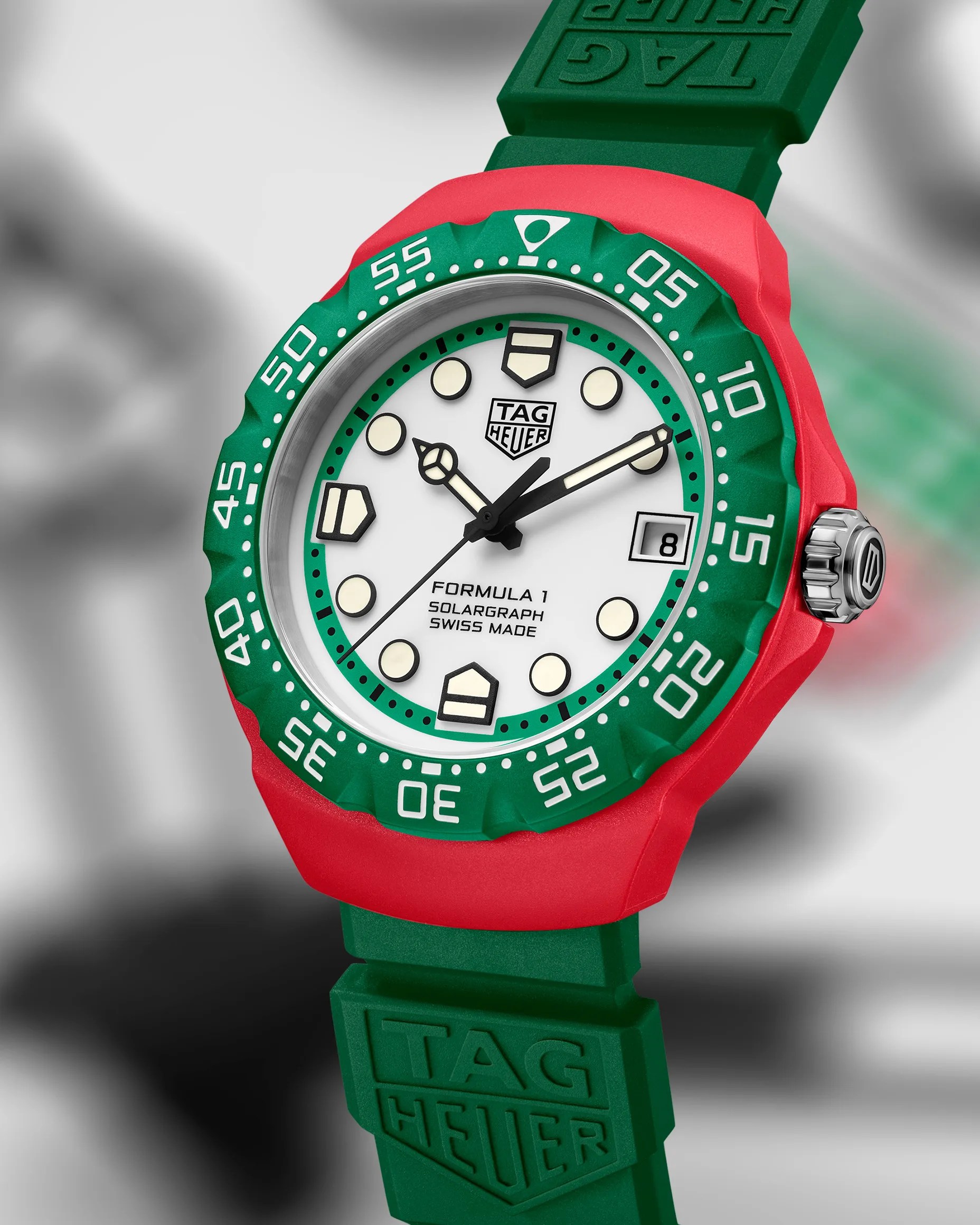 a green and red TAG Heuer watch