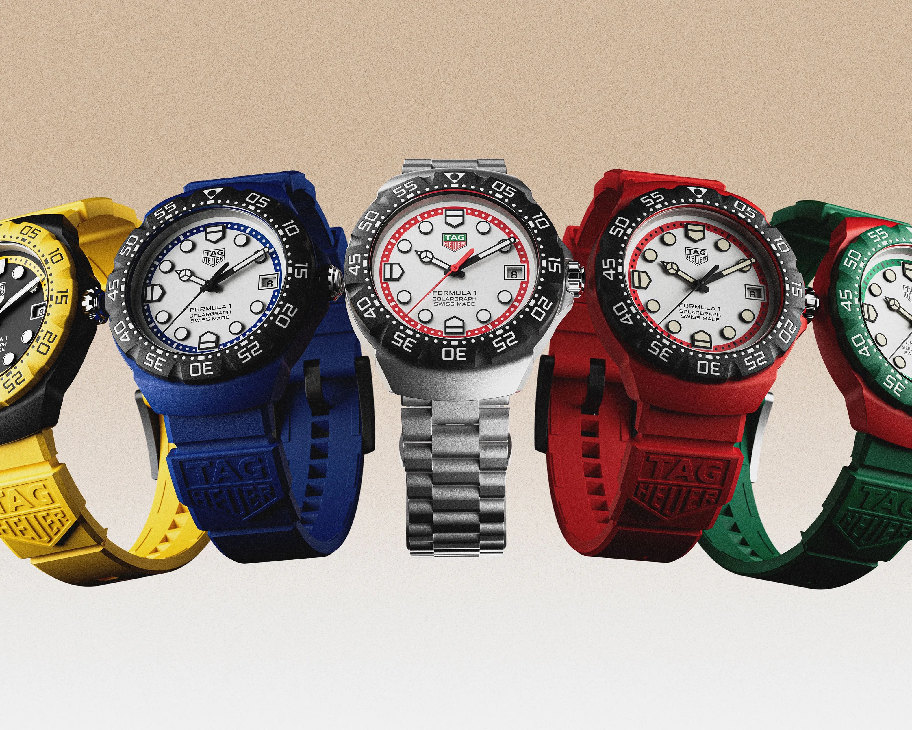 a gorup of five TAG Heuer watches