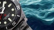 a closeup of a timex dive watch against a wavy background