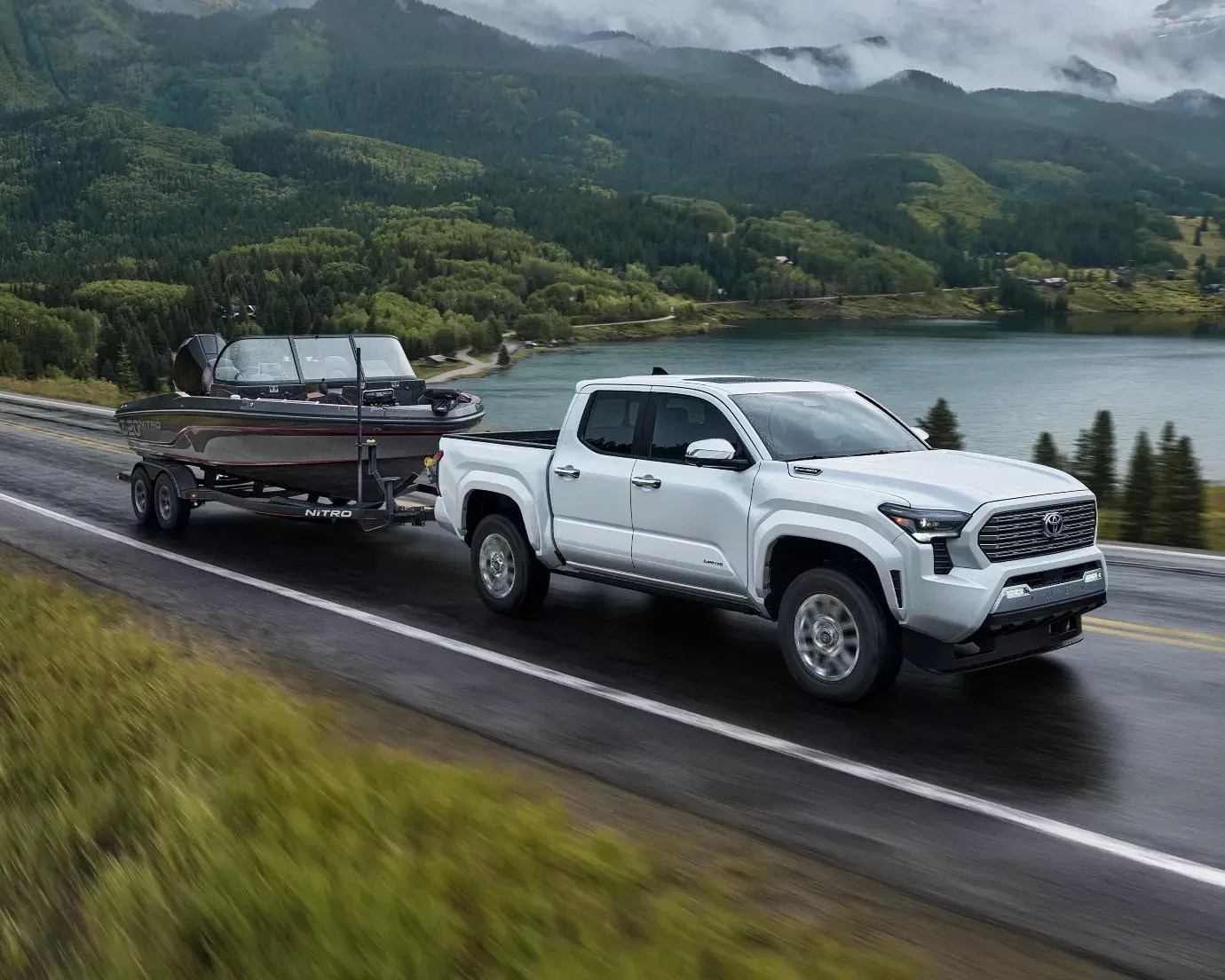 Toyota Tacoma truck towing a boat