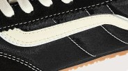 a close up of the Vans logo on a pair of black sneakers