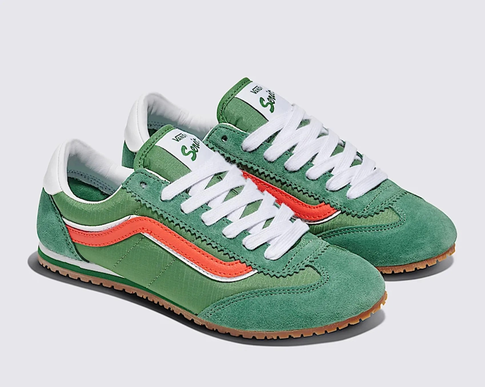 a pair of green Vans sneakers
