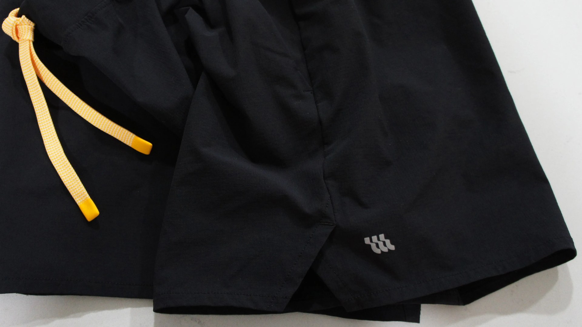 close up of a pair of black Wellen running shorts