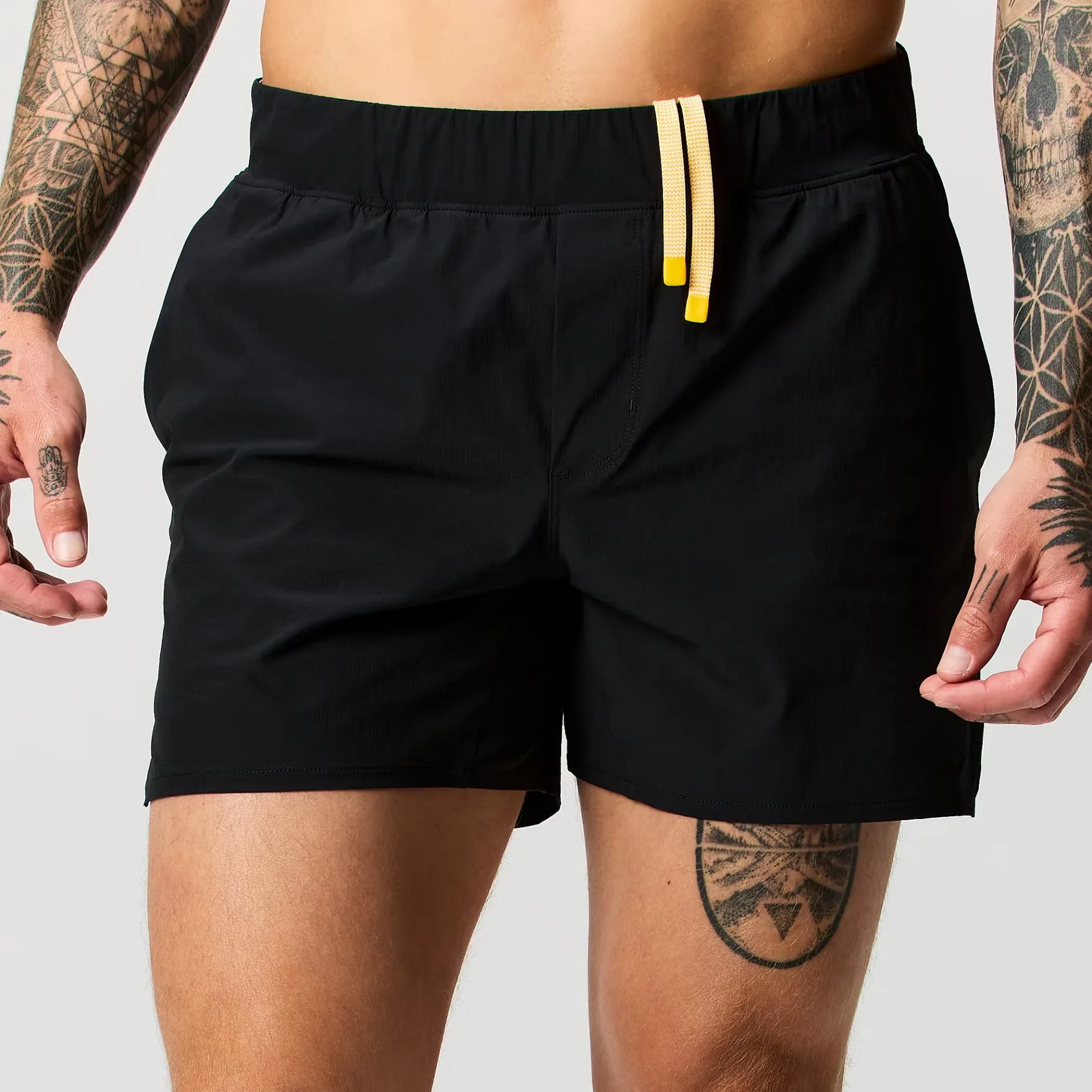 a man wearing black running shorts