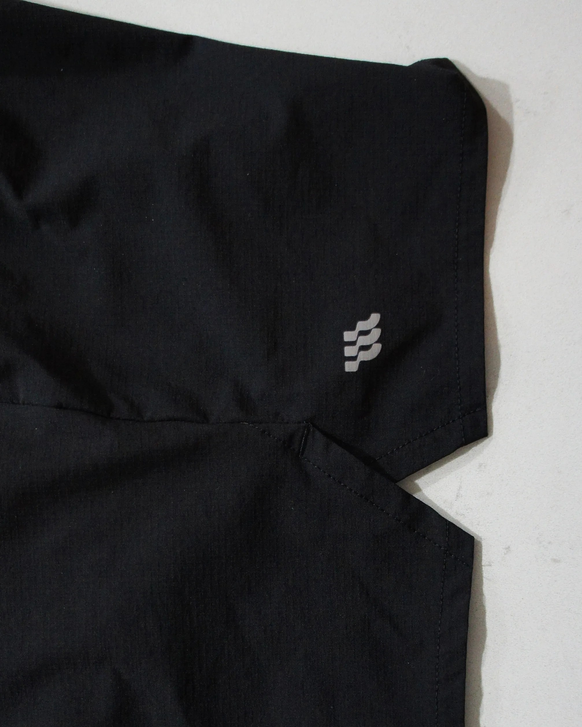 the outseam vent of black running shorts
