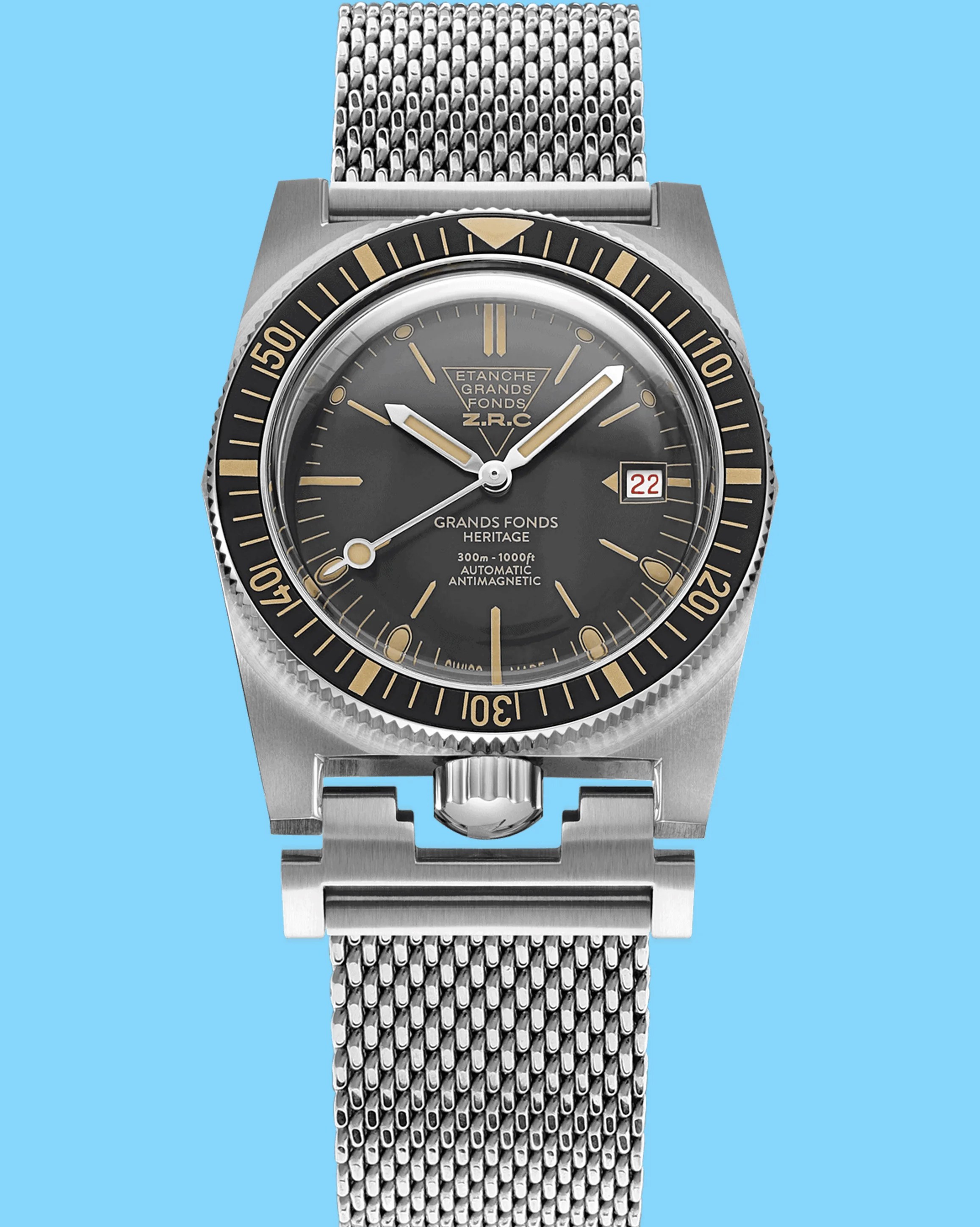 a steel ZRC dive watch with a black dial and bezel