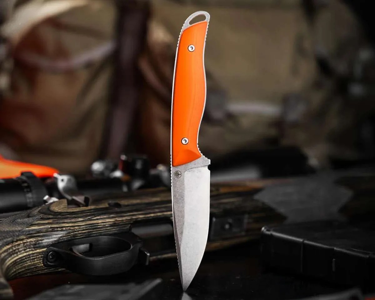 Böker USA Backcountry Bushcraft Knife in front of tent and hunting materials