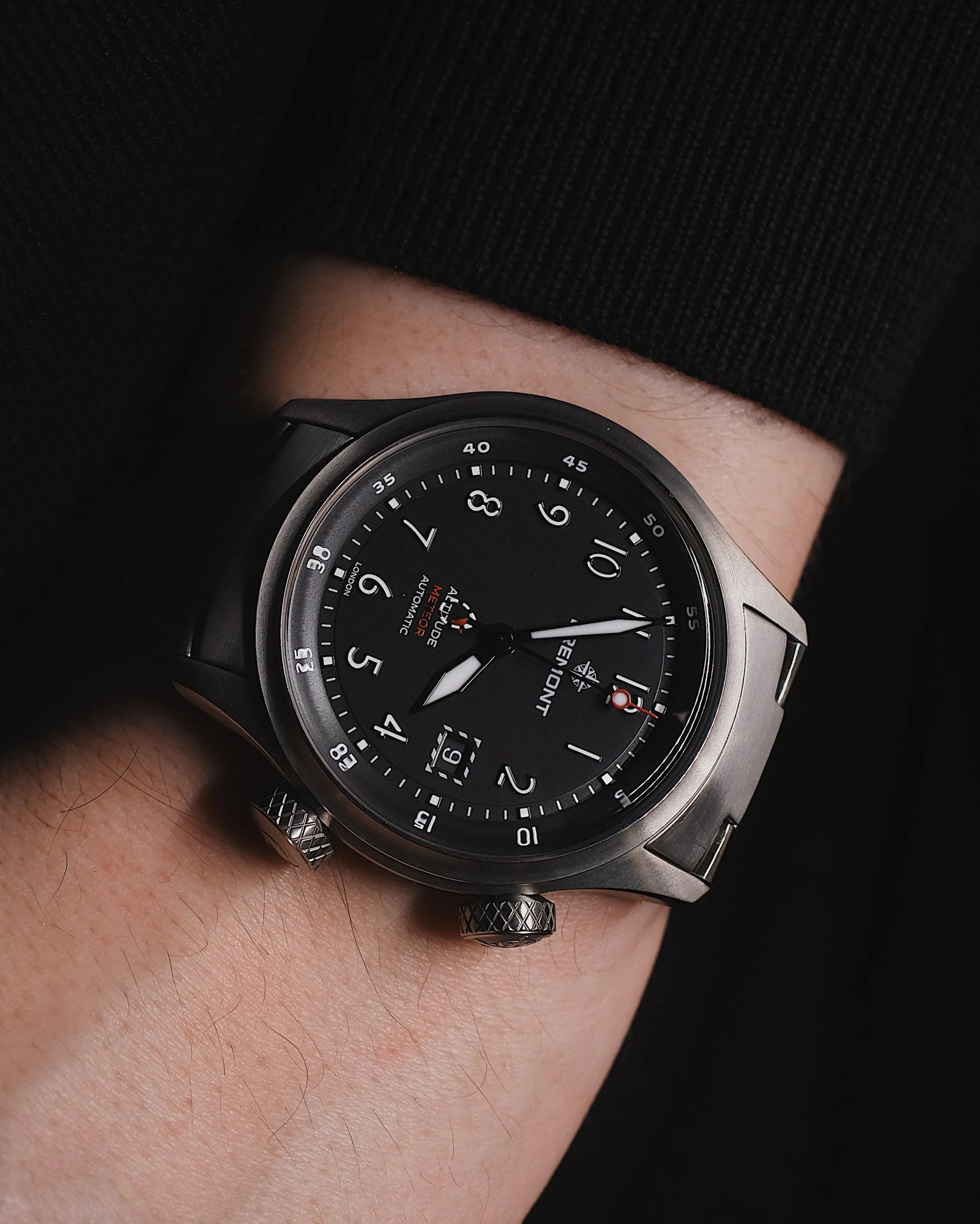 Bremont Altitude MB Meteor on a mans wrist wearing a black sweater