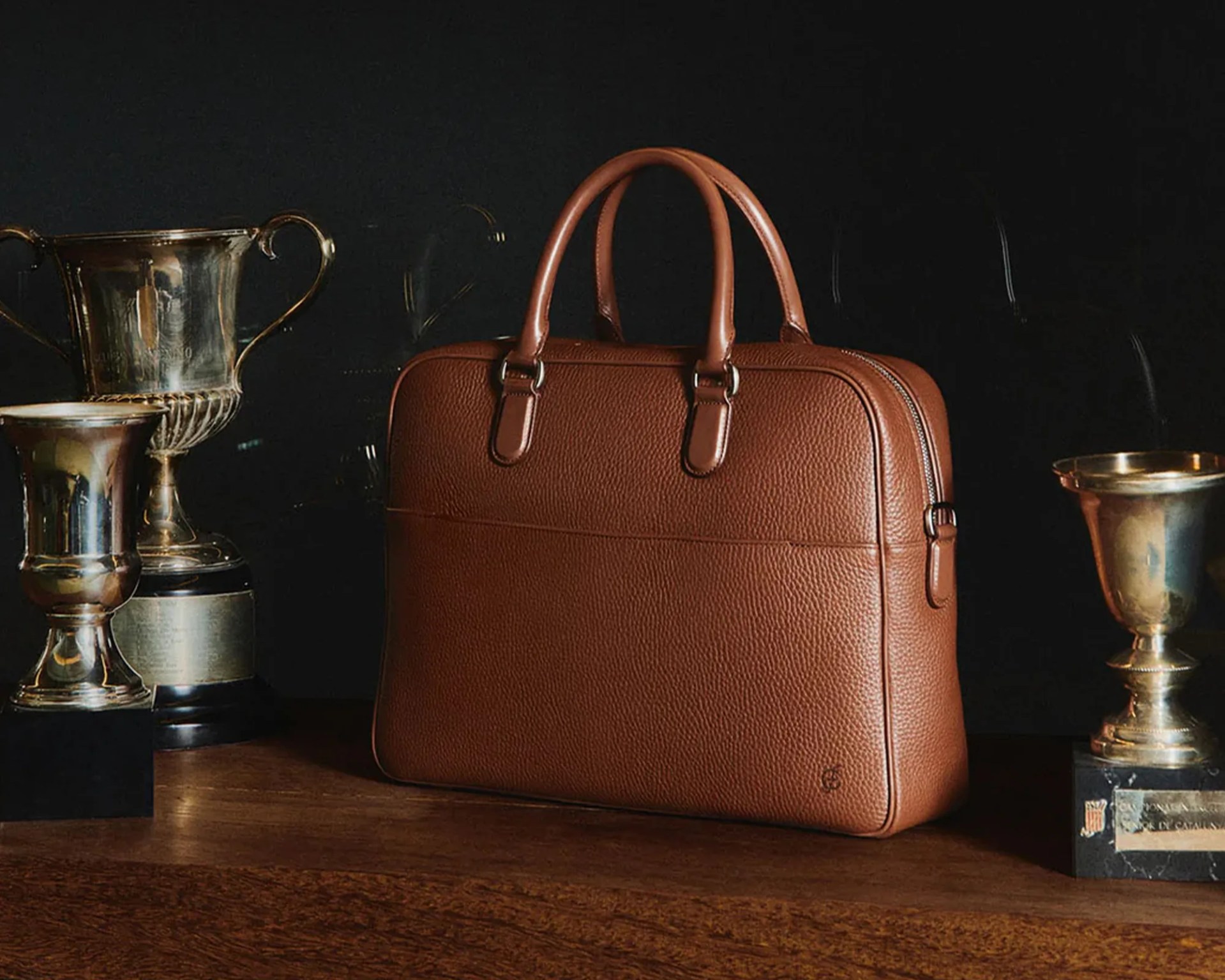 Carl Friedrik Sonder Collection briefcase next to trophies