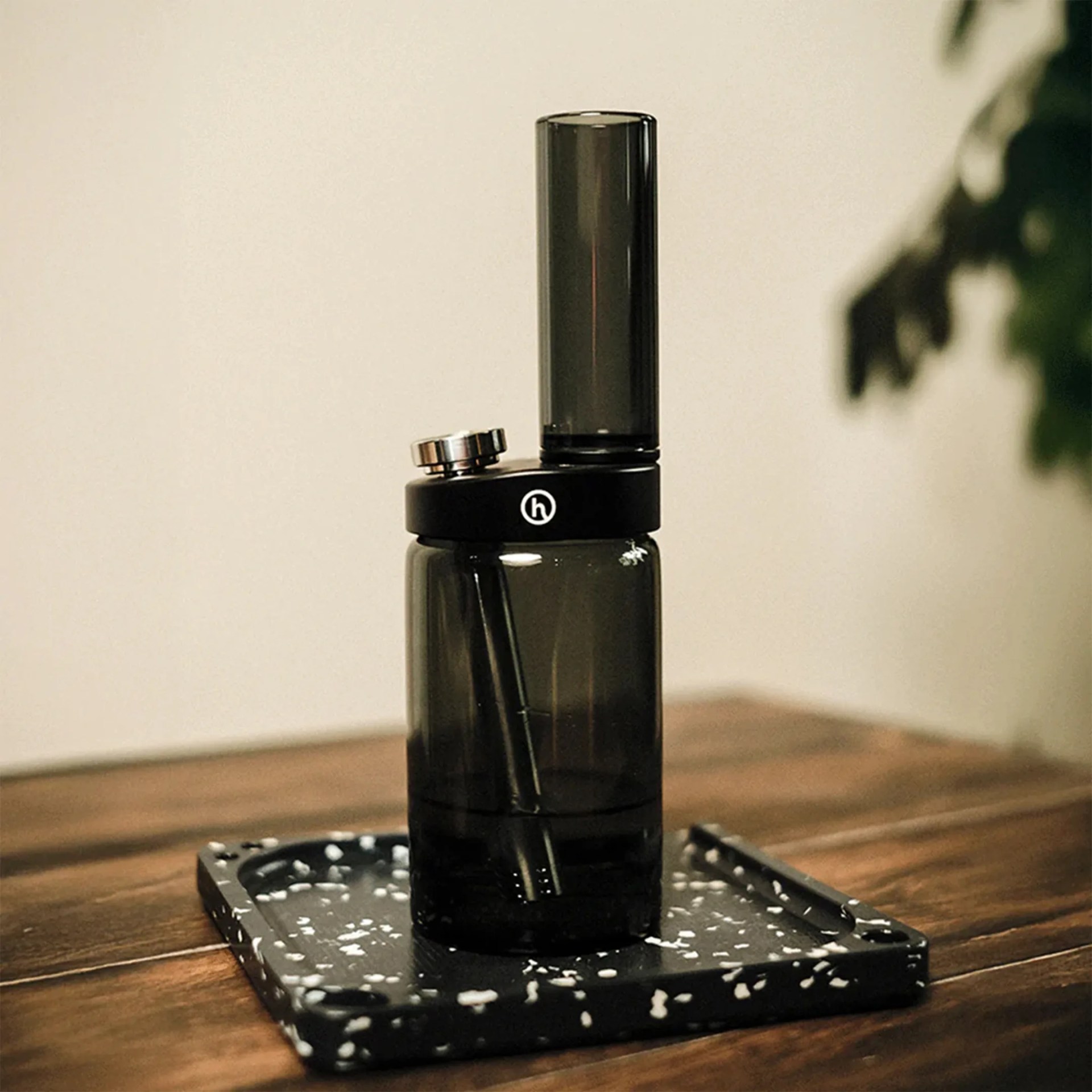 Honest Smoked Capsule bong on rolling tray on table