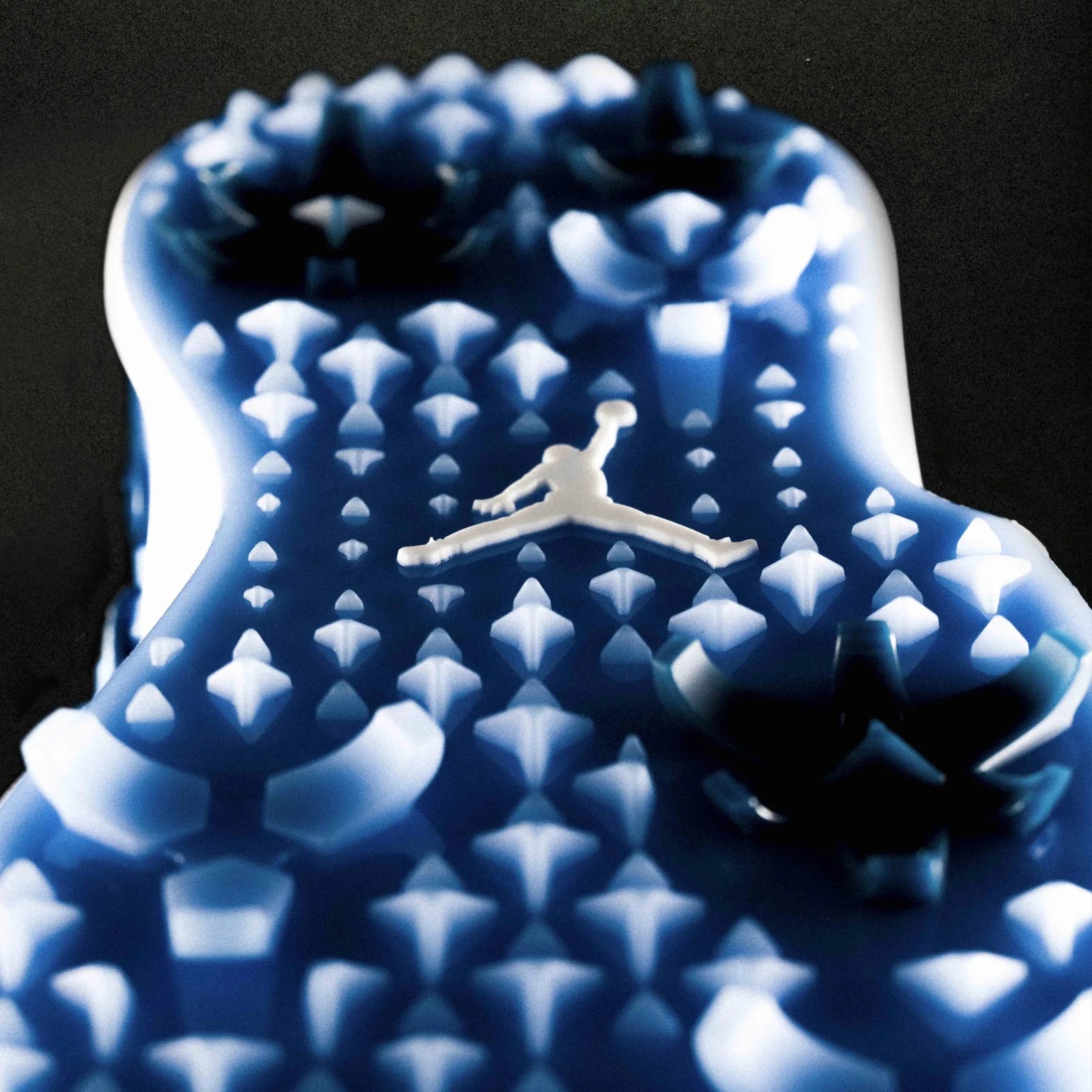 A close-up of the integrated traction pattern of the Jordan Brand Air Rev golf shoe