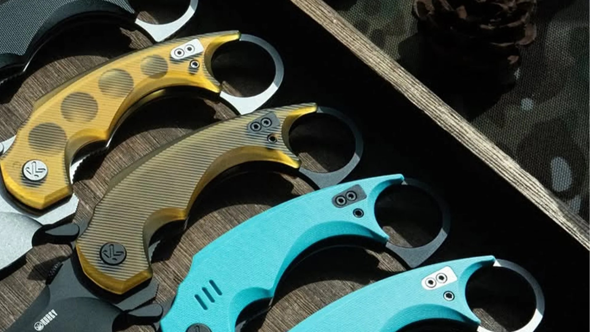 Closeup of Kubey Jaw Folding Karambit knife handles