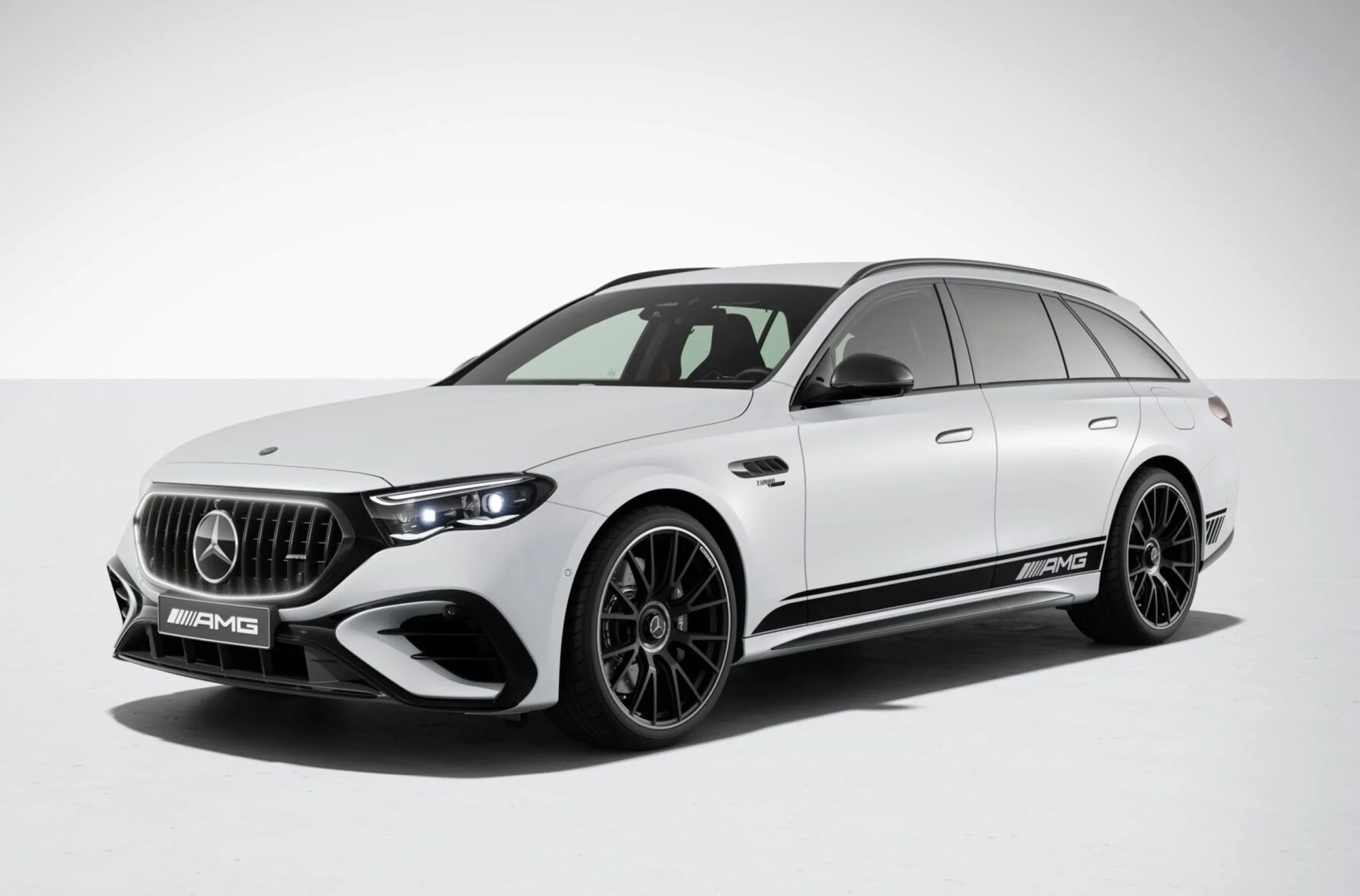 The 2026 Mercedes-AMG E53 Hybrid Wagon in white shown against a light grey background. 