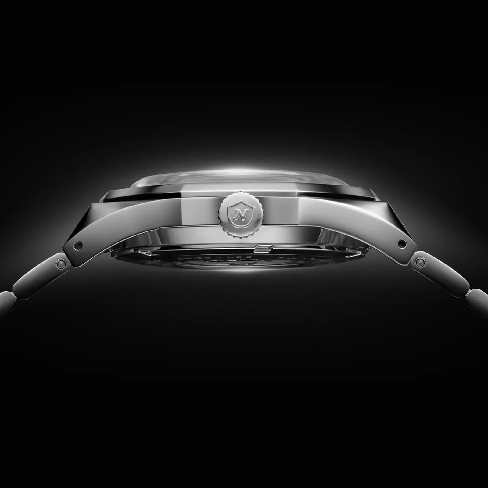 A profile view of the The Nivada Grenchen F77 MarkII SST in black against a black background