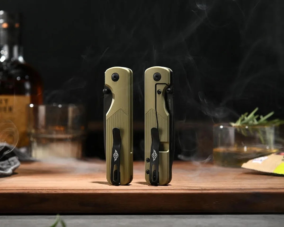 Oknife Duron Folding Knives closed on cutting board with cocktail ingredients