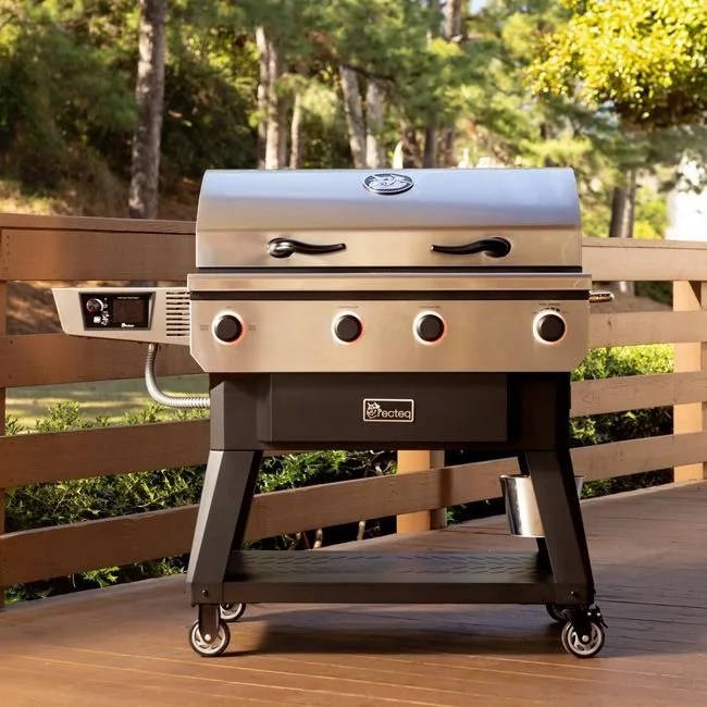 A Recteq X-Fire Pro 825 shown closed sitting on a wooden deck. 