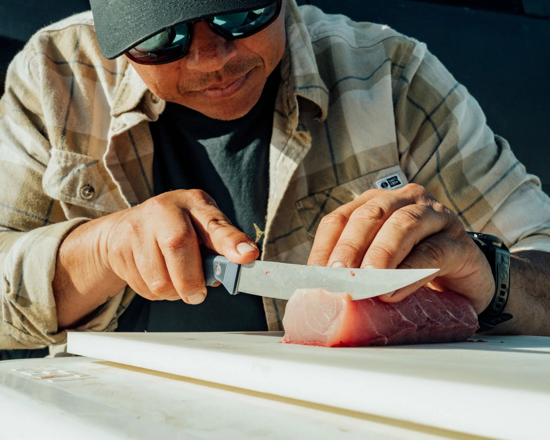 The James Brand Uncharted Collection Humboldt filet knife cutting fish