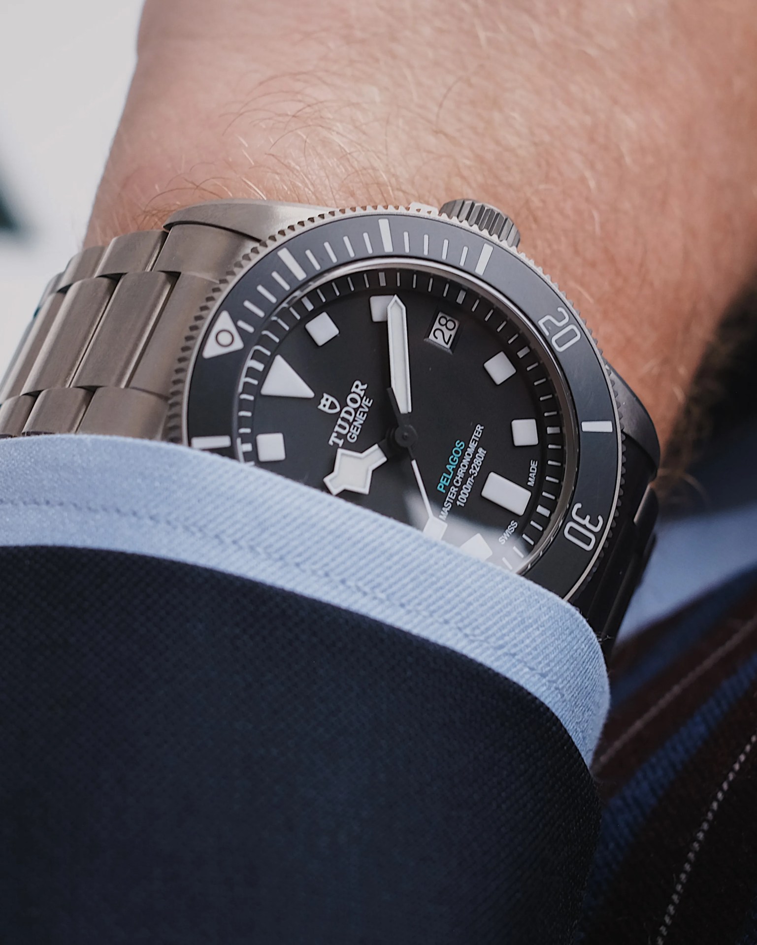 Tudor Pelagos Ultra dive watch shown up close being worn on a male wrist.