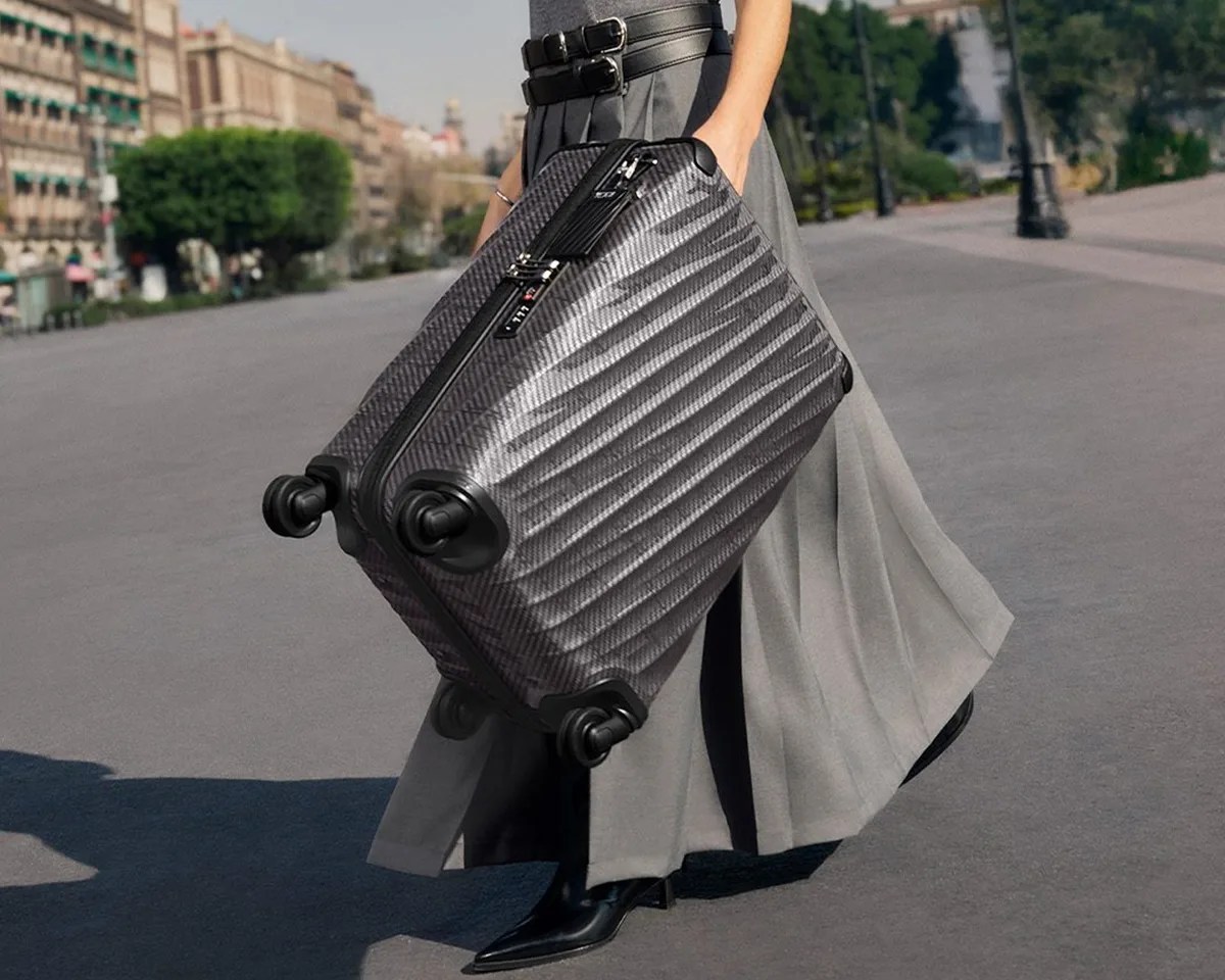 Tumi 19 Degree Lite Luggage picked up by model