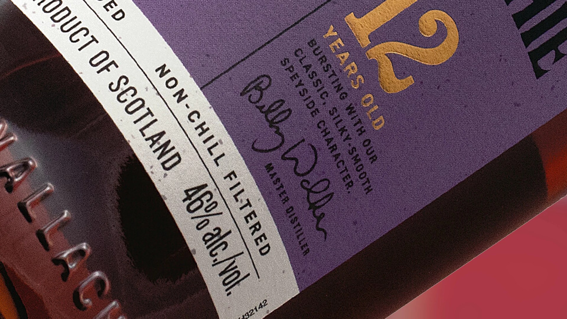 A close up of the corner label of a bottle of GlenAllachie 12 Year Old Whisky, named the Best Single Malt Whisky of 2025 by the World Whiskies Awards