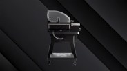 A profile view of the Recteq X-Fire Pro 825 grill against a dark metallic background.